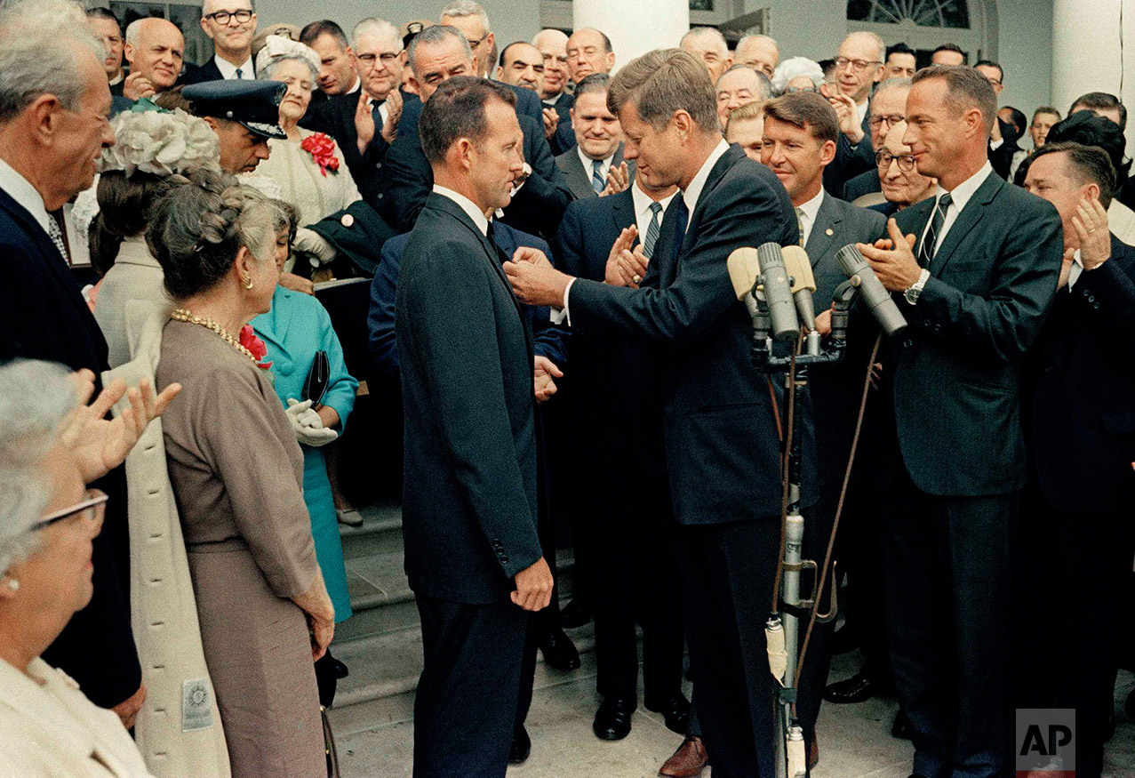  U. S. President John F. Kennedy, right, shakes hands with Astronaut Gordon Cooper at the White House during a reception, May 21, 1963. Gordon Cooper  performed the last Mercury mission and completed 22 orbits in Faith 7 to evaluate effects of one da