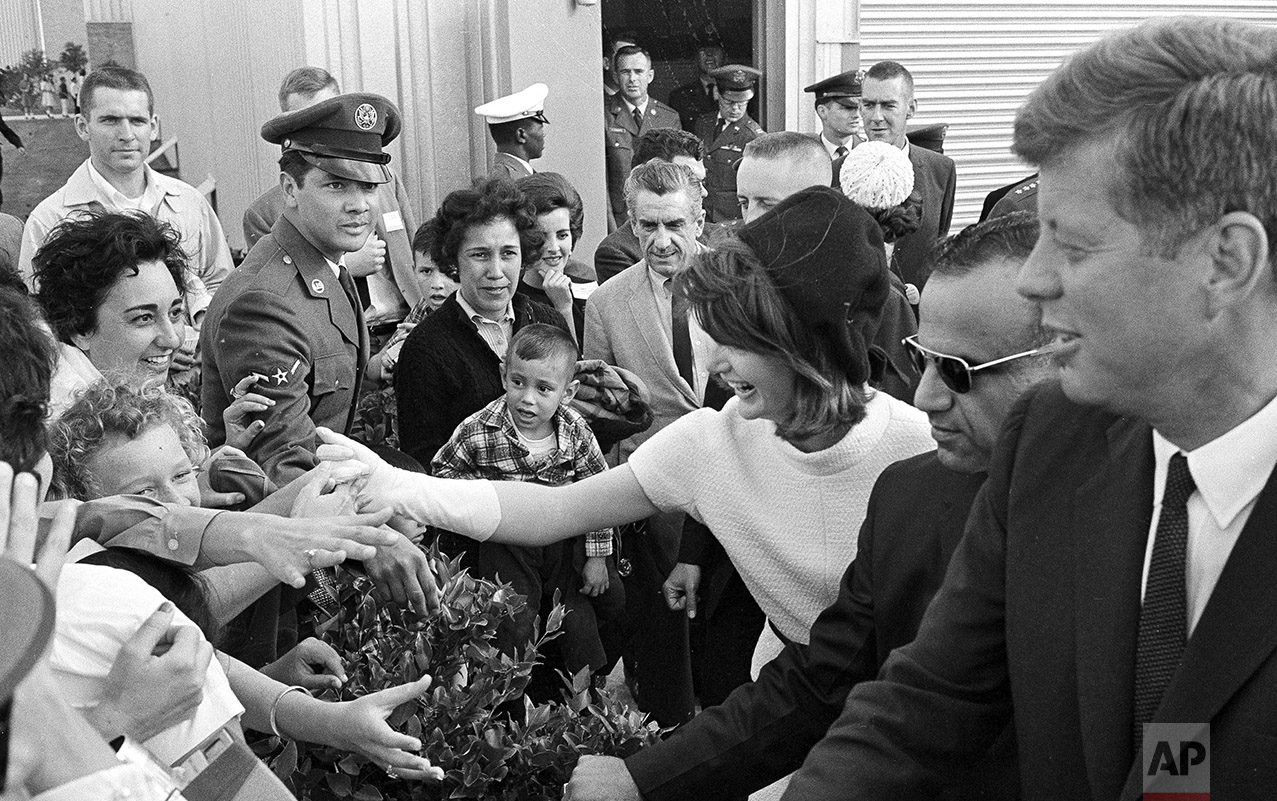  Eager hands reach out to shake hands with President John F. Kennedy and first lady Jacqueline Kennedy as they visited San Antonio, Tex., where the president dedicated the Aerospace Medical Center at Brooks Air Force Base, Nov. 21, 1963. (AP Photo/Te