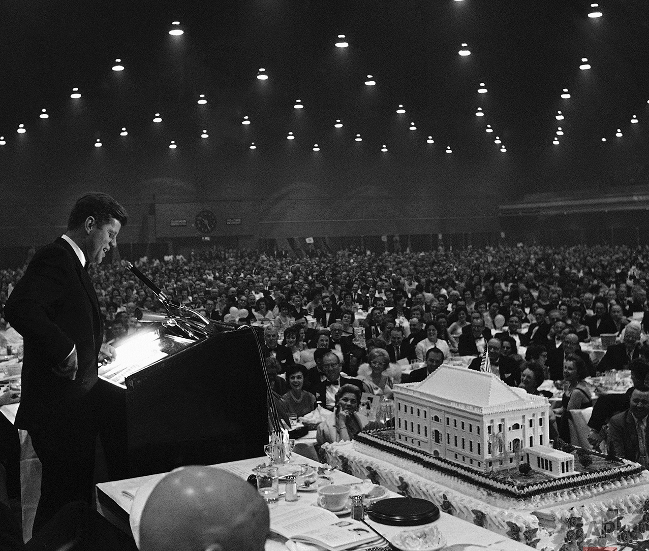  President Kennedy smiles as he delivers a joking remark to the 6,000 attending the $100-a-plate Democratic dinner on May 27, 1961 in Washington's National Guard Armory, to help him celebrate his 44th birthday. The event was held in advance of the ac