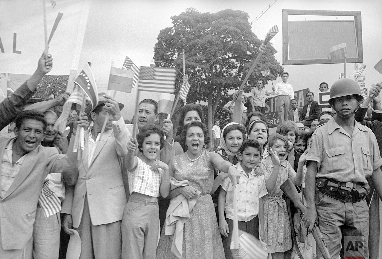  Crowd greets Venezuela’s President Betancourt and U.S. President John F. Kennedy as they ride from airport into city of Caracas, Venezuela on Dec. 16, 1961. (AP Photo) 