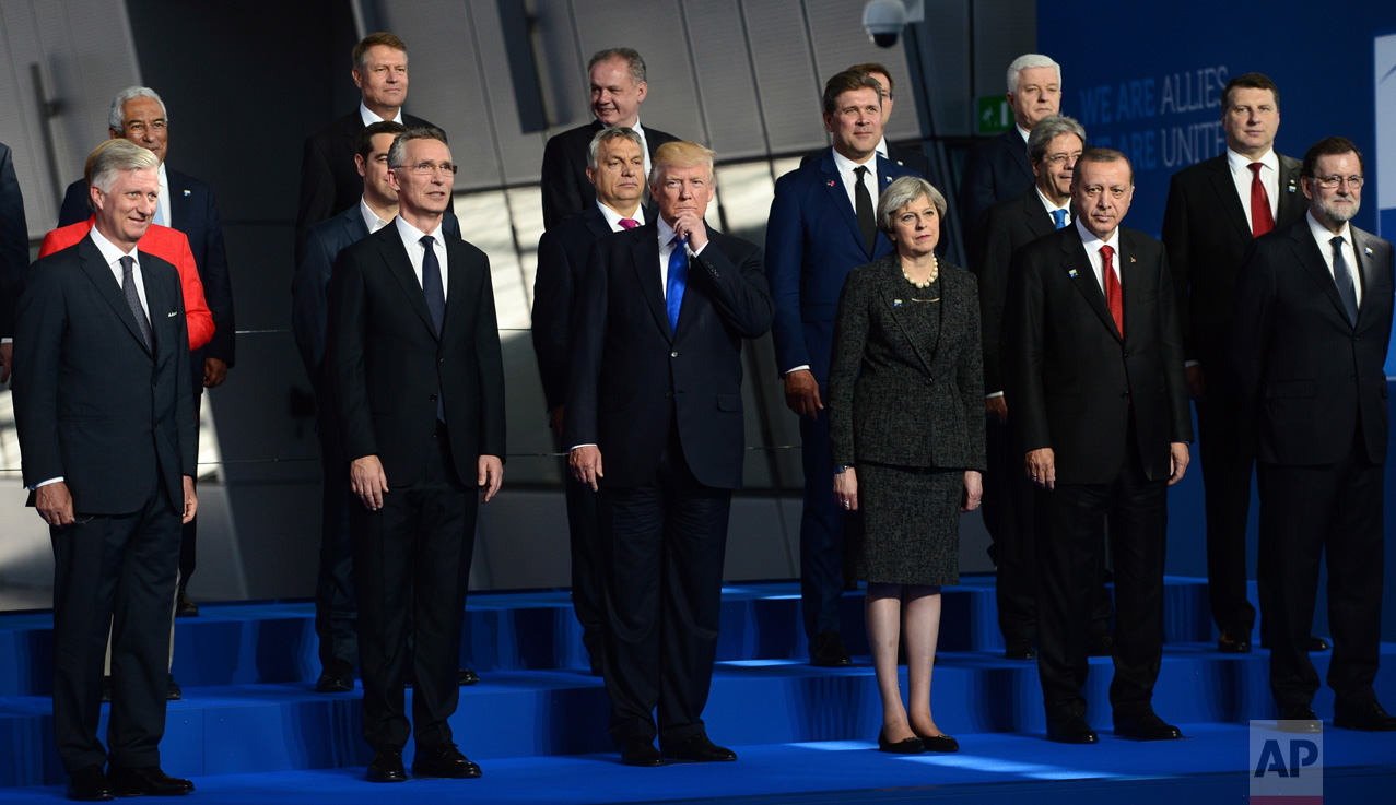  U.S. President Donald Trump, center, flanked by British Prime Minister Theresa May, third from right, and NATO Secretary General Jens Stoltenberg, second from left, joins fellow leaders in a group photo at NATO headquarters during the NATO Summit in