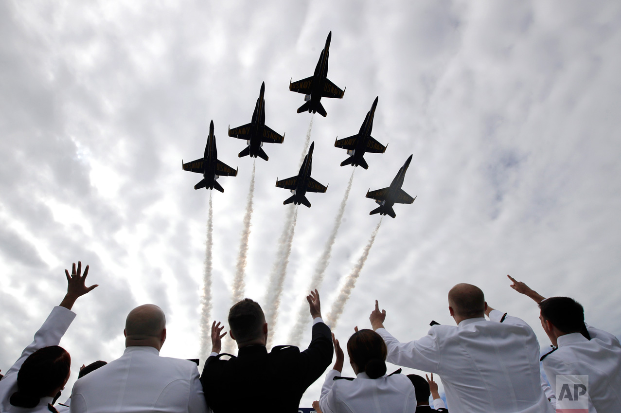 U.S. Navy Blue Angels fighter jets perform a flyover above graduating U.S. Naval Academy midshipmen during the Academy's graduation and commissioning ceremony in Annapolis, Md., Friday, May 26, 2017. (AP Photo/Patrick Semansky) 