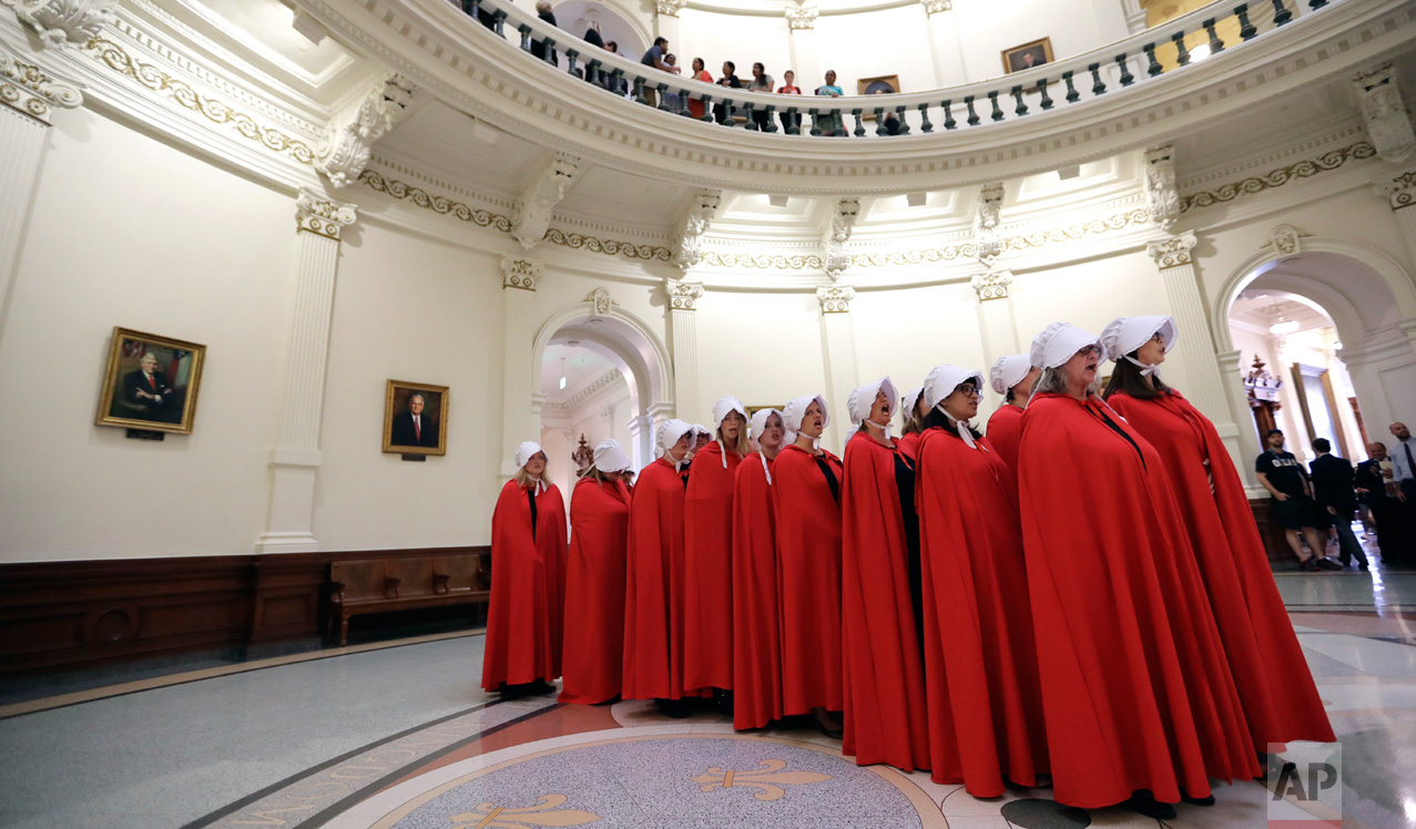  Activists dressed as characters from "The Handmaid's Tale" chant in the Texas Capitol Rotunda as they protest SB8, a bill that would require health care facilities, including hospitals and abortion clinics, to bury or cremate any fetal remains wheth