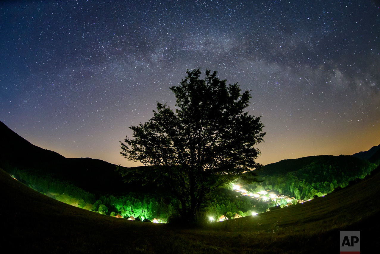 The Milky Way arcs in the summer night sky seen near Repashuta, 170 kilometers (105 miles) northeast of Budapest, Hungary, on Thursday, June 15, 2017. (Peter Komka/MTI via AP)