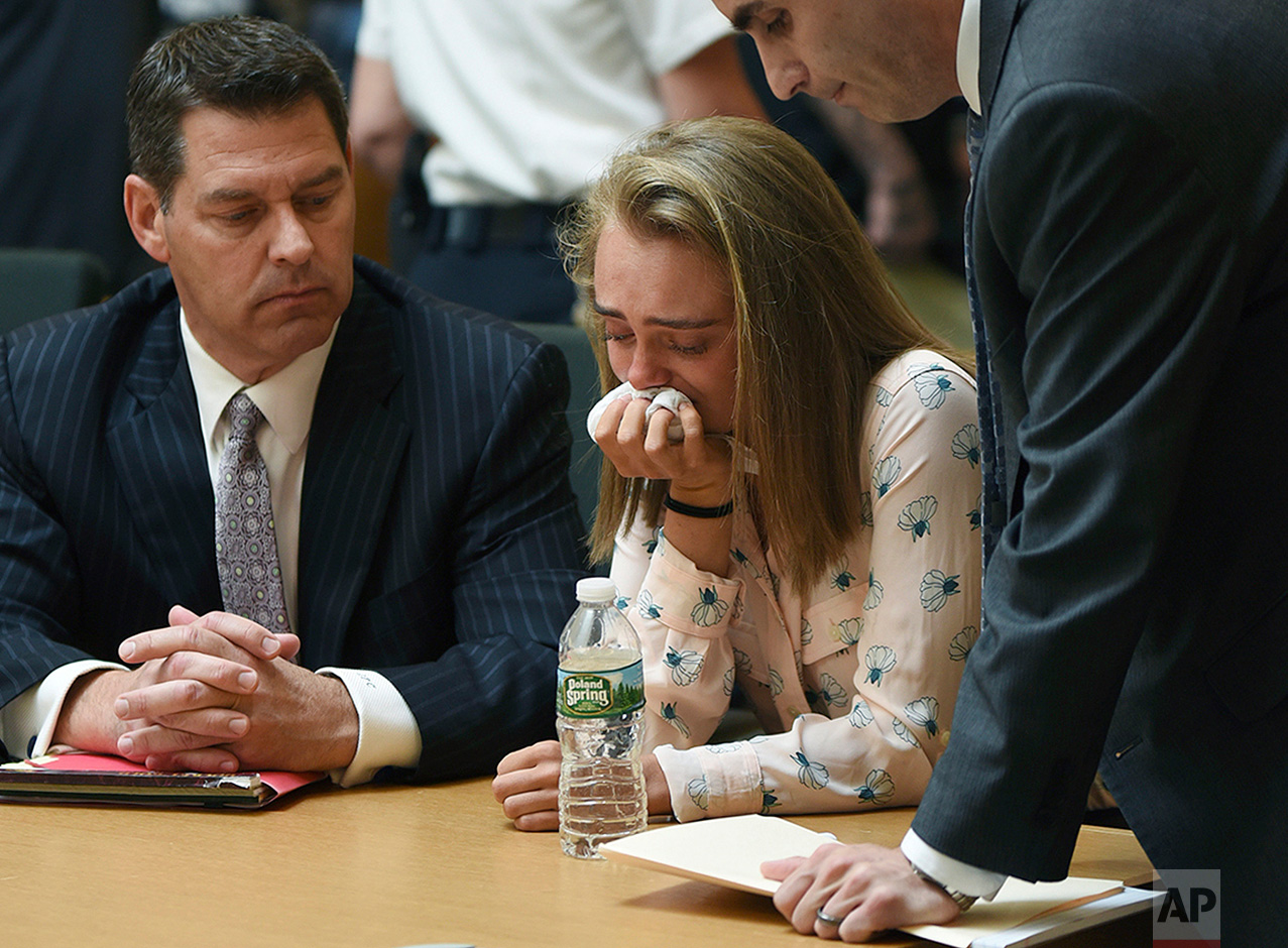  Michelle Carter cries while flanked by defense attorneys Joseph Cataldo, left, and Cory Madera, after being found guilty of involuntary manslaughter in the suicide of Conrad Roy III, Friday, June 16, 2017, in Bristol Juvenile Court in Taunton, Mass.