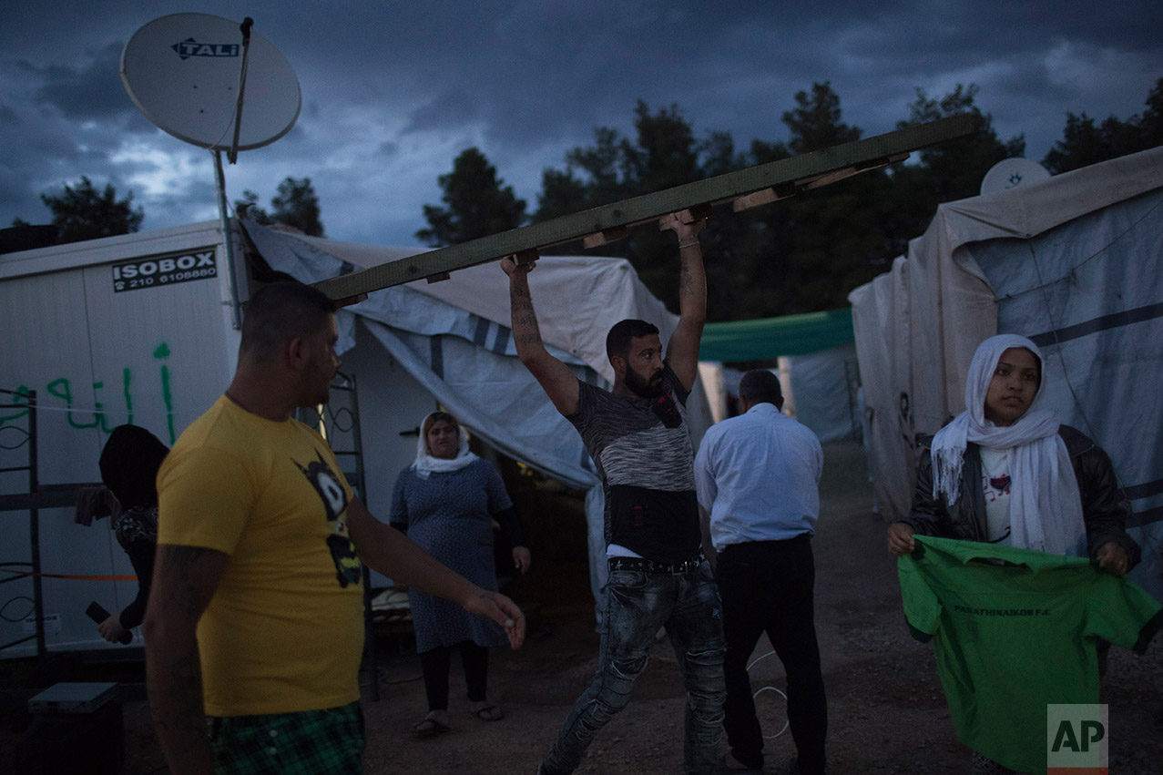  In this May 26, 2017 photo, a Syrian man carries a ladder at the refugee camp of Ritsona about 86 kilometers (53 miles) north of Athens.&nbsp;(AP Photo/Petros Giannakouris) 