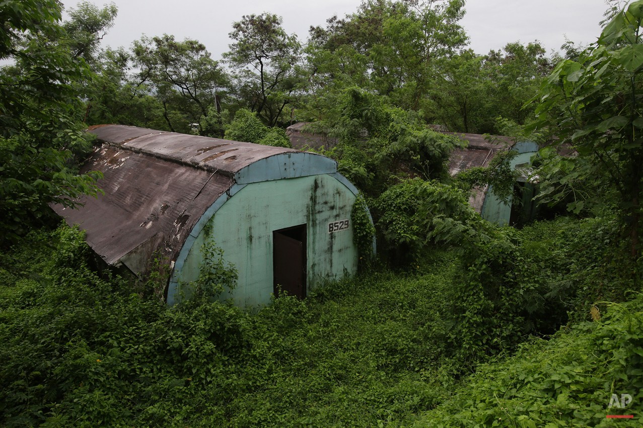  In this Oct. 18, 2014, photo, a row of concrete structures called "Quonset huts" lie inside the Subic Bay Freeport Zone, Zambales province, northern Philippines. The huts were used as barracks for U.S. Marines inside the former American naval base. 