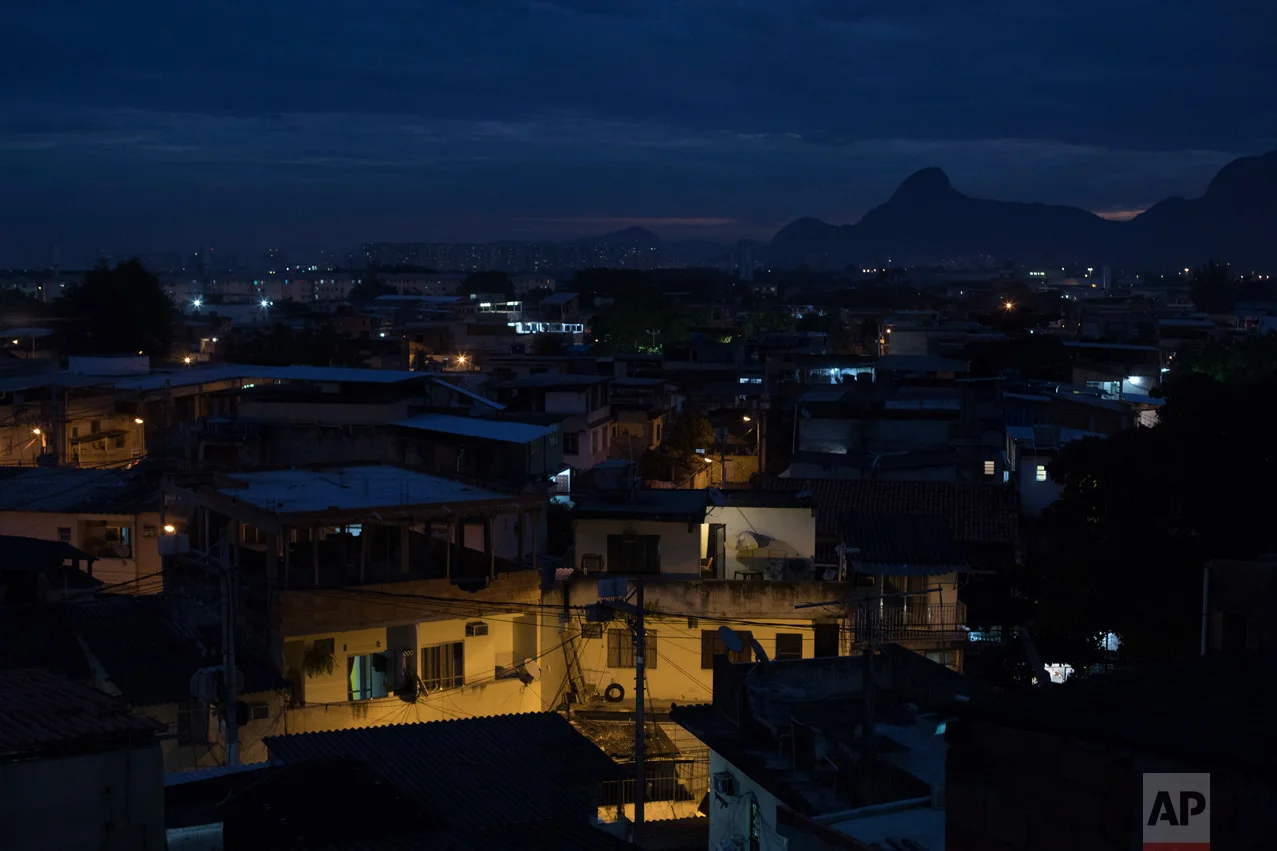 In this June 6, 2017 photo, homes stand at dusk in the City of God, one of Rio de Janeiro's most notorious and violent slums in Brazil. (AP Photo/Leo Correa)