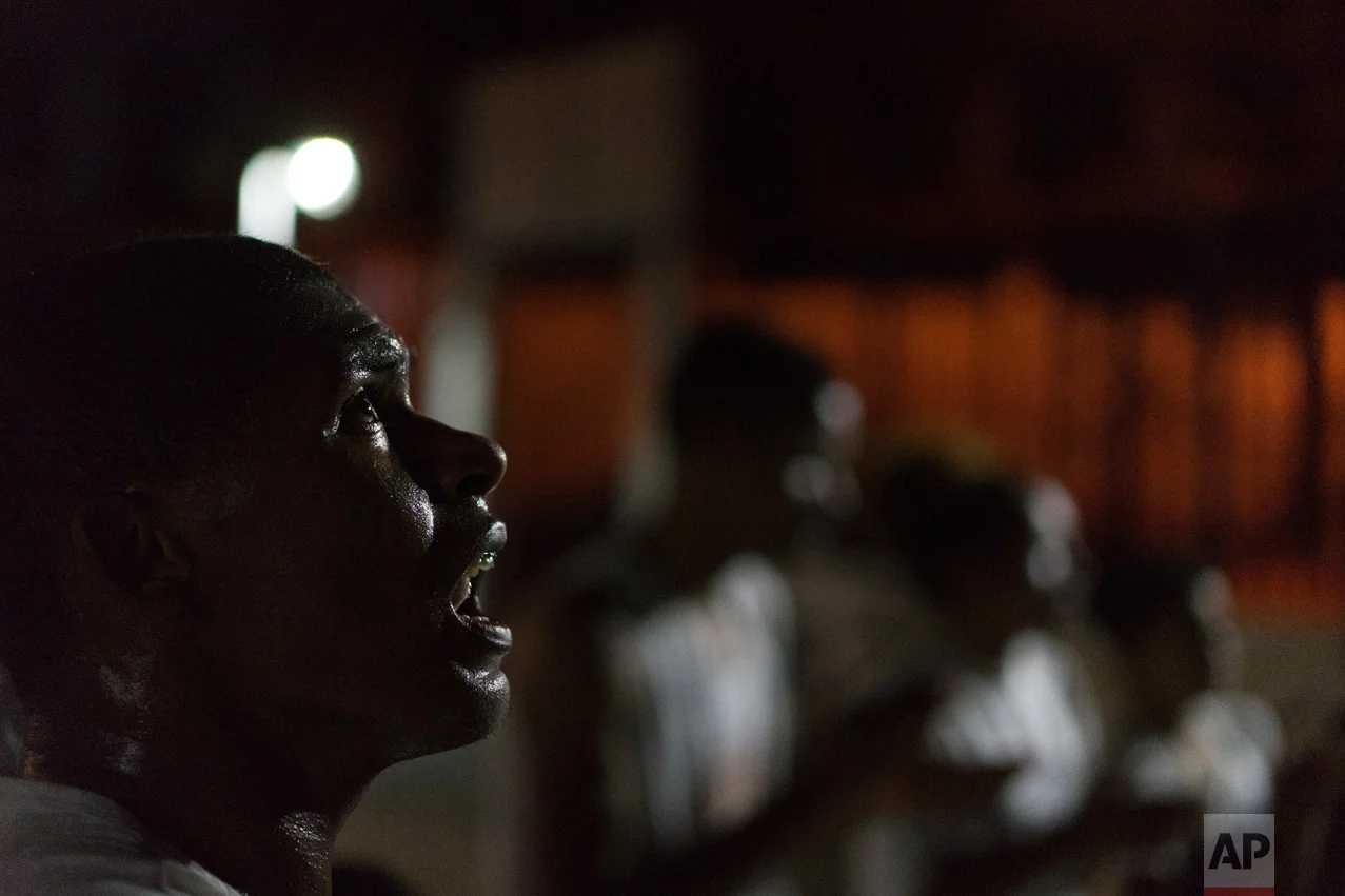 In this June 5, 2017 photo, Mike Leonardo de Jesus da Silva, 24, sings during a Copeira class at a community center kept open only by the extraordinary effort of residents of the City of God slum in Rio de Janeiro, Brazil. (AP Photo/Leo Correa)