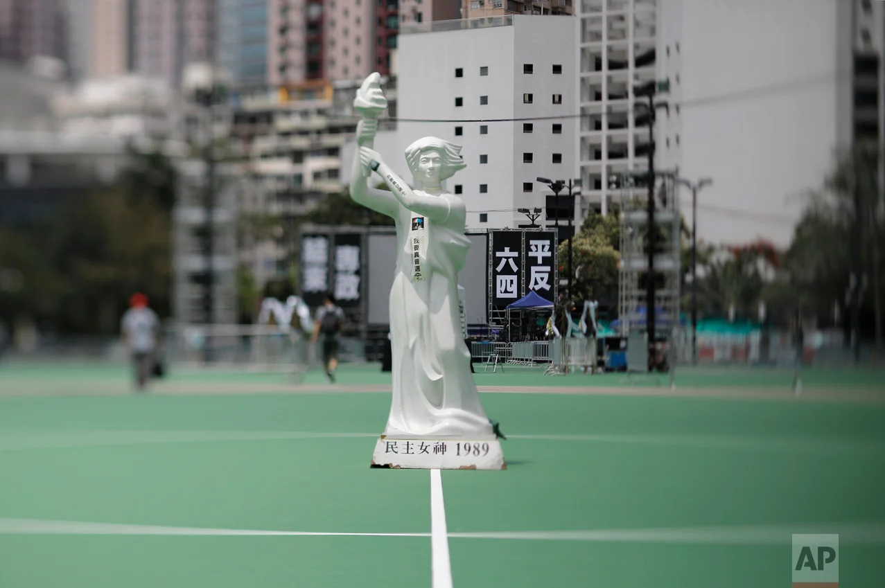 In this June 4, 2017, photo made with a tilt-shift lens, a statue of the Goddess of Democracy is displayed at Hong Kong's Victoria Park ahead of a candlelight vigil for victims of the Chinese government's military crackdown nearly three decades ago on protesters in Beijing's Tiananmen Square. (AP Photo/Vincent Yu)