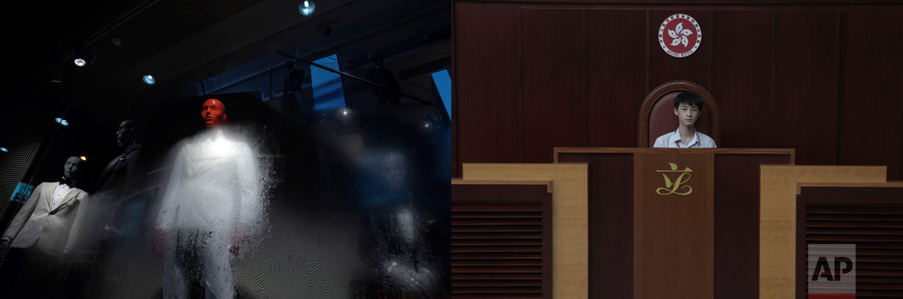 In this combination of photos, left: A mannequin with a red head is displayed at a fashion store in Hong Kong, Tuesday, June 20, 2017; and right: A student stands in a replica of the Hong Kong Legislative Council, Wednesday, June 21, 2017. (AP Photo/Kin Cheung)