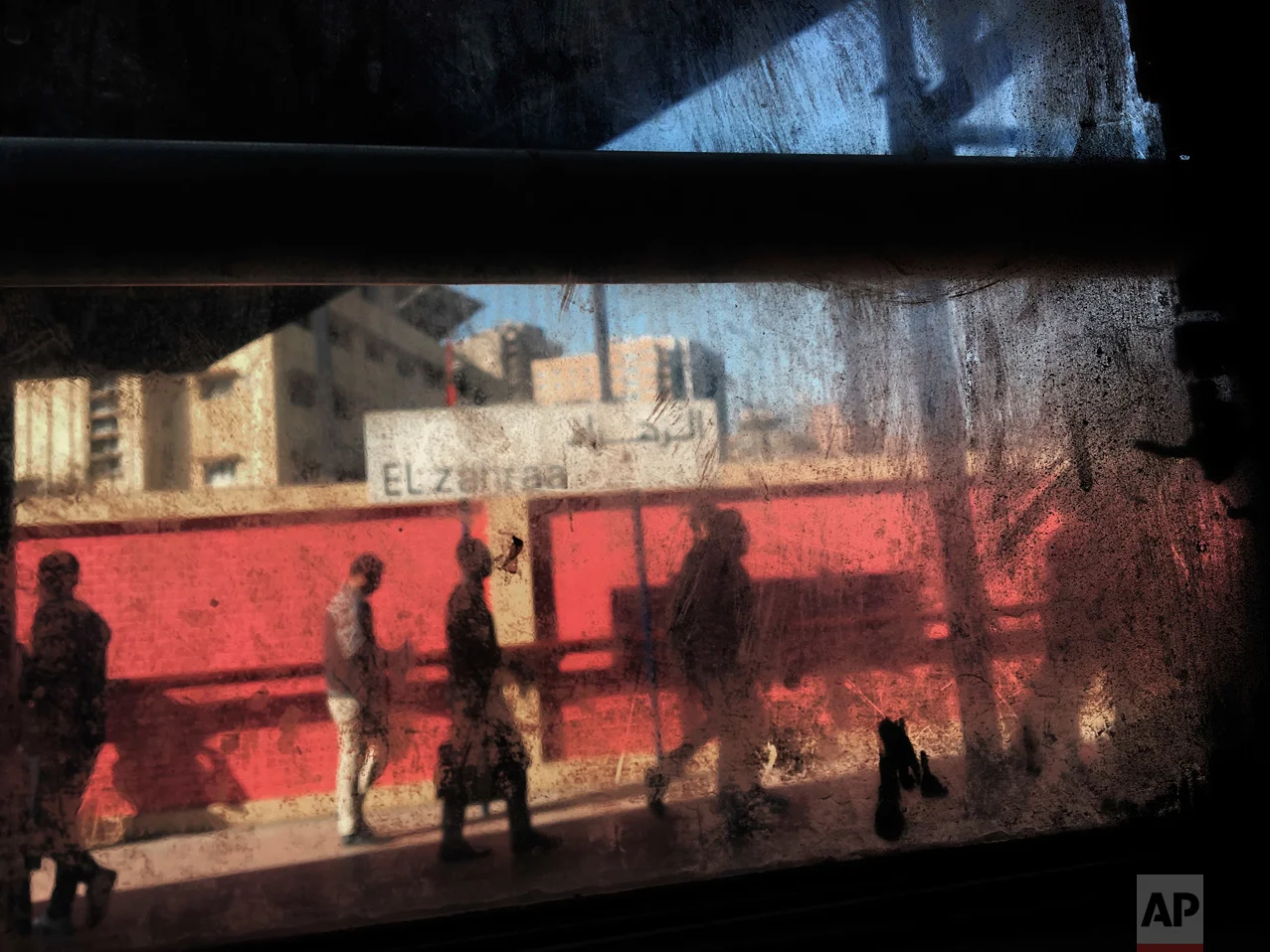 In this March 13, 2017 photo, people are seen from the window of a metro car, at El Zahraa metro station in Cairo, Egypt. (AP Photo/Nariman El-Mofty)