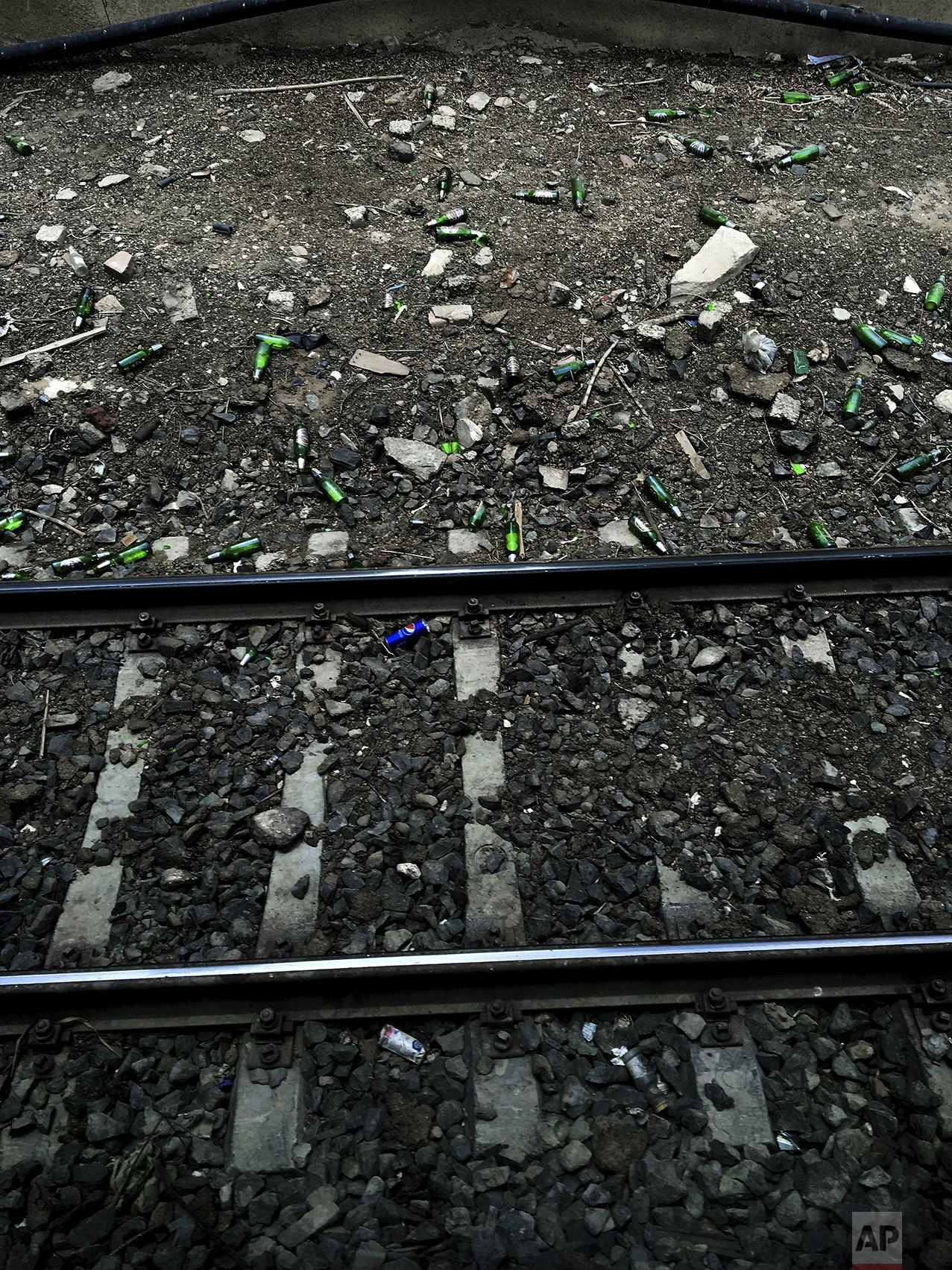 In this May 17, 2017 photo, beer bottles and soda cans lay along the railing of a metro station, in Cairo, Egypt. (AP Photo/Nariman El-Mofty)