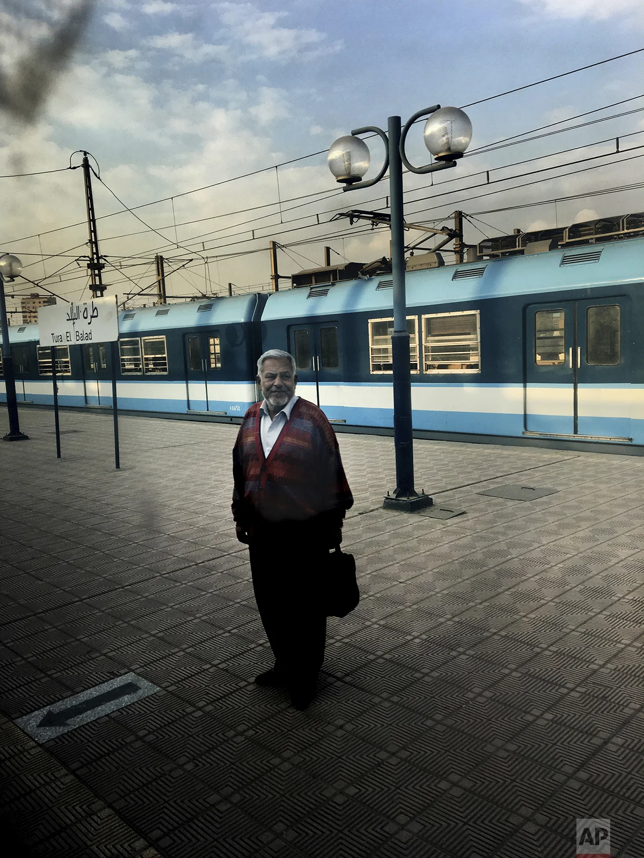 In this Feb. 1, 2017 photo, a man waits for a train at Tura El Balad metro station, in Cairo, Egypt. (AP Photo/Nariman El-Mofty)