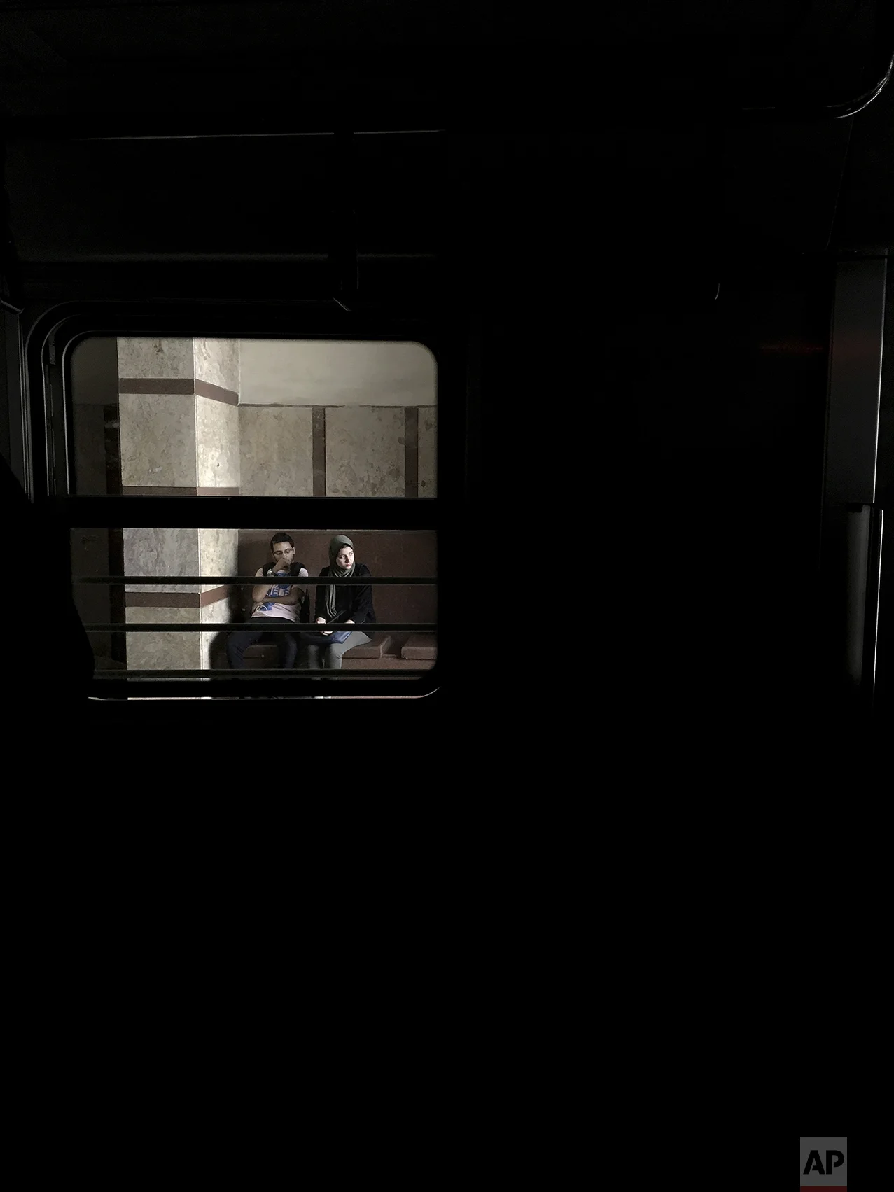 In this May 17, 2017 photo, people wait for a train at a metro station, in Cairo, Egypt. (AP Photo/Nariman El-Mofty)