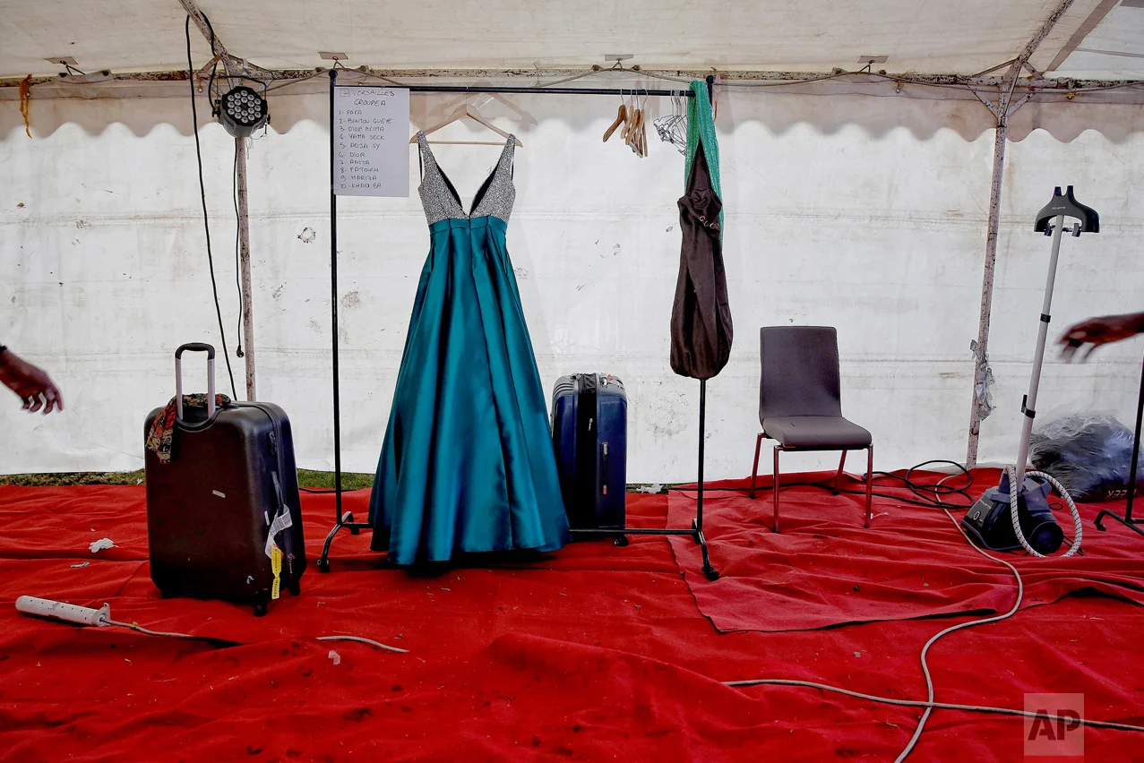 A dress hands on a clothes rack at the end of Dakar Fashion Week in the Senegalese capital, Friday July 1, 2017. (AP Photo/Finbarr O'Reilly)