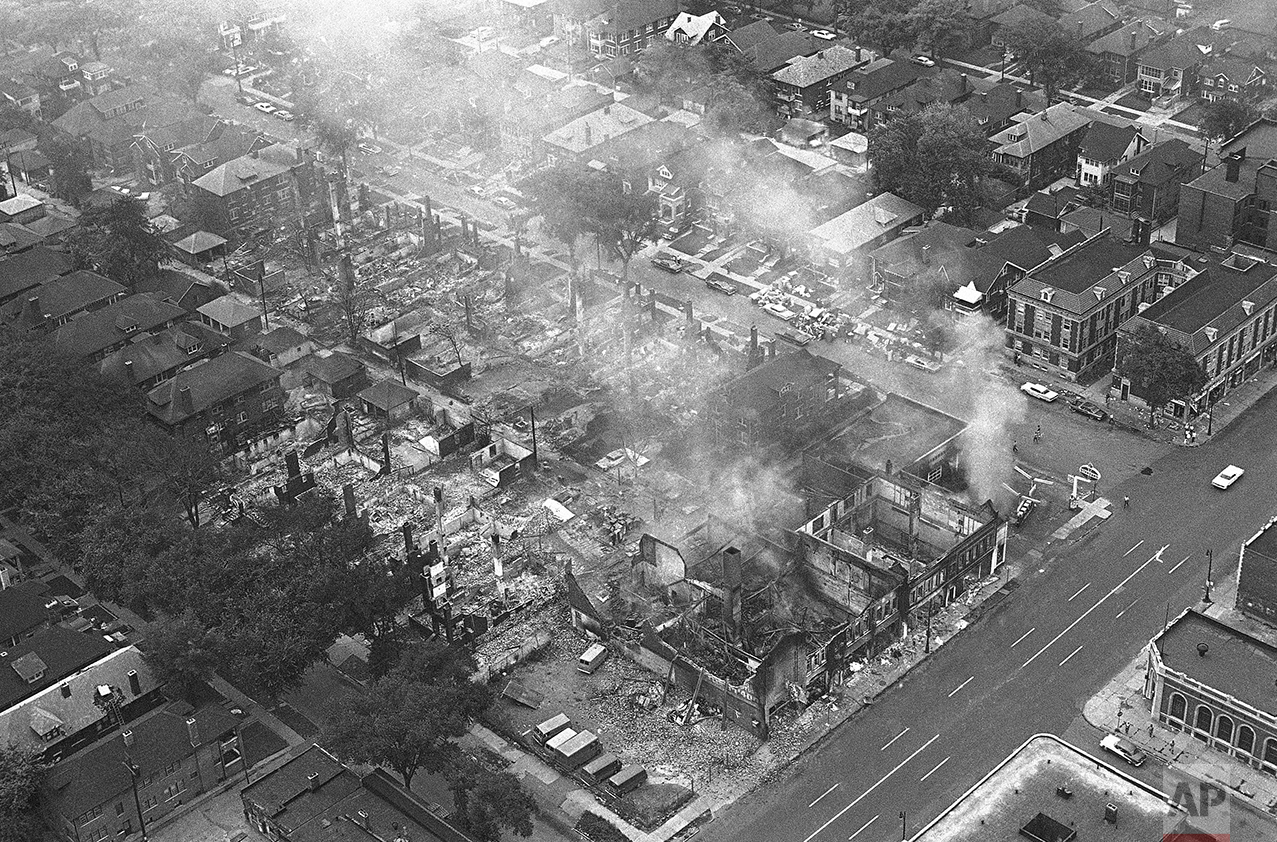 Entire block of buildings was destroyed by fire in Detroit, July 24, 1967 after rioters firebombed the filling station, right, and the fire spread to other buildings. Rampaging blacks hampered firemen called to fight the blaze. Intersection is Linwood, right, and Pingree on Detroit’s near West Side. (AP Photo)