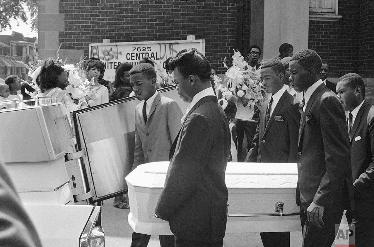 Pallbearers carry the tiny casket of Tanya Blanding, 4, a victim of riots in Detroit, Tuesday, August 1, 1967. The girl was killed as a hail of police and National Guard bullets swept an apartment building where she huddled on the floor. Officials said the flare of a match used to light a cigarette was mistaken for the flash of a sniper's gun. (AP Photo)