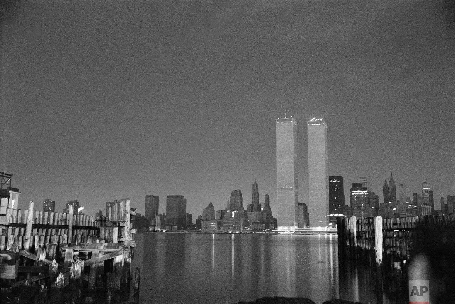 The World Trade Center stands out against a blackened New York City skyline after a power failure struck the city, July 14, 1977. Lightning striking a power station is blamed for the blackout. (AP Photo/Lennox McLendon)