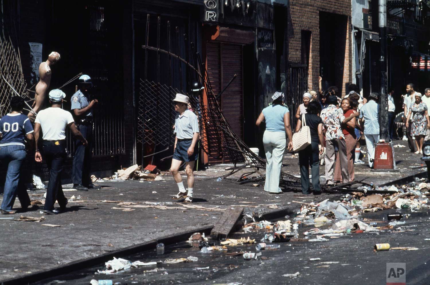  This is the aftermath of looting on 110th Street and Third Avenue in the East Harlem section of Manhattan, New York City during the power failure, July 14, 1977. (AP Photo/Ira Schwarz) 