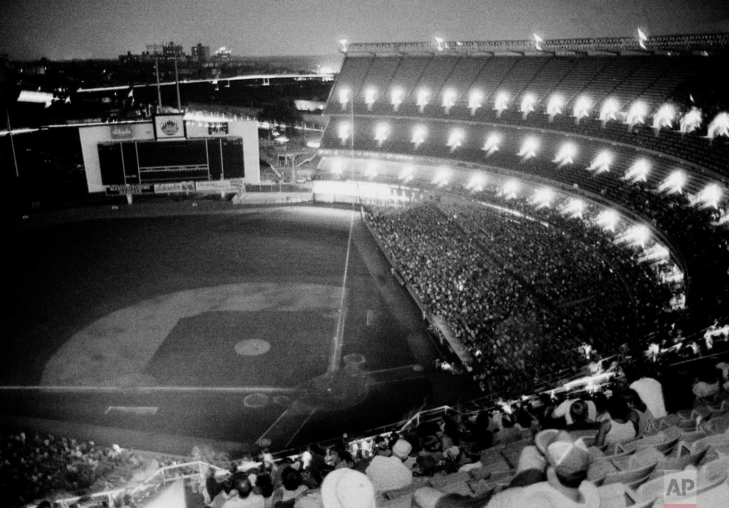  New York's Shea Stadium lies in darkness during the bottom of the sixth inning after the lights went out during the game with the Chicago Cubs, July 13, 1977.  The Mets were not the only ones blacked out as it appeared the power failure affected mos