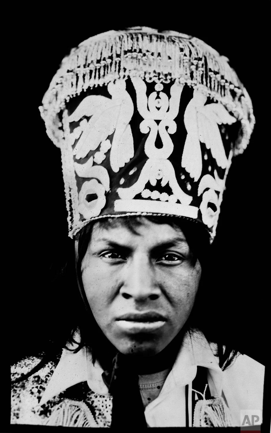 In this June 13, 2017 photo, Edison Olgado, 23, poses for a portrait in the Sinakara Valley, in Peru's Cusco region, during the Qoyllur Rit’i festival, translated from the Quechua language as Snow Star. Edison is a dancer representing the Quispicanchis nation. (AP Photo/Rodrigo Abd)