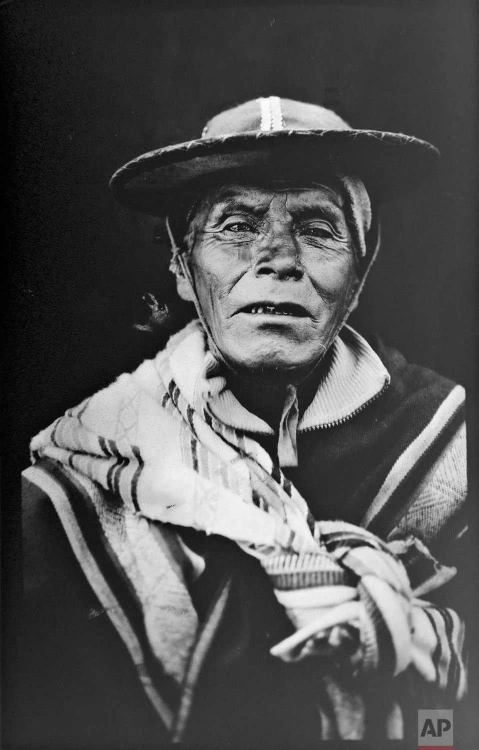 In this June 13, 2017 photo, Justino Quispe Quispe, 78, poses for a portrait in the Sinakara Valley, in Peru's Cusco region, during the Qoyllur Rit’i festival, translated from the Quechua language as Snow Star. Justino is a dancer in the "Comparsa Runa Canchi" (AP Photo/Rodrigo Abd)