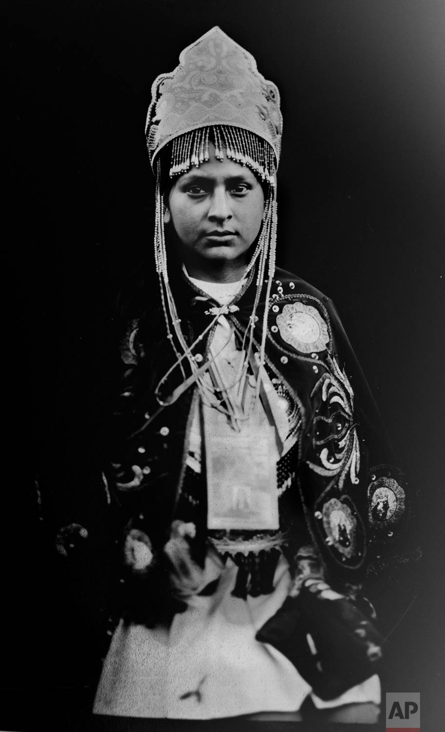 In this June 12, 2017 photo, Nelida Soto Salazar, 21, poses for a portrait in the Sinakara Valley, in Peru's Cusco region, during the Qoyllur Rit’i festival, translated from the Quechua language as Snow Star. Nelida, who represents the Tahuantinsuyo nation, performs in a dance called "Chunchaca" which venerates Our Lady of Mount Carmel, known locally as Mamacha Carmen. (AP Photo/Rodrigo Abd)