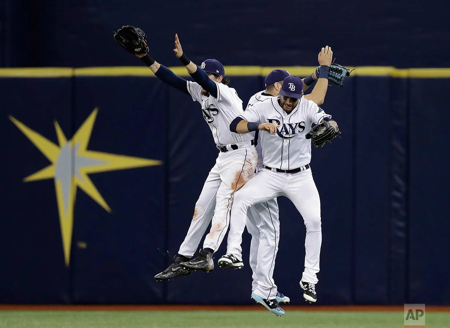 Tampa Bay Rays center fielder Colby Rasmus, right fielder Steven Souza Jr., and center fielder Kevin Kiermaier, from left, celebrate the team's 3-1 win over the Chicago White Sox in a baseball game Wednesday, June 7, 2017, in St. Petersburg, Fla. (AP Photo/Chris O'Meara)