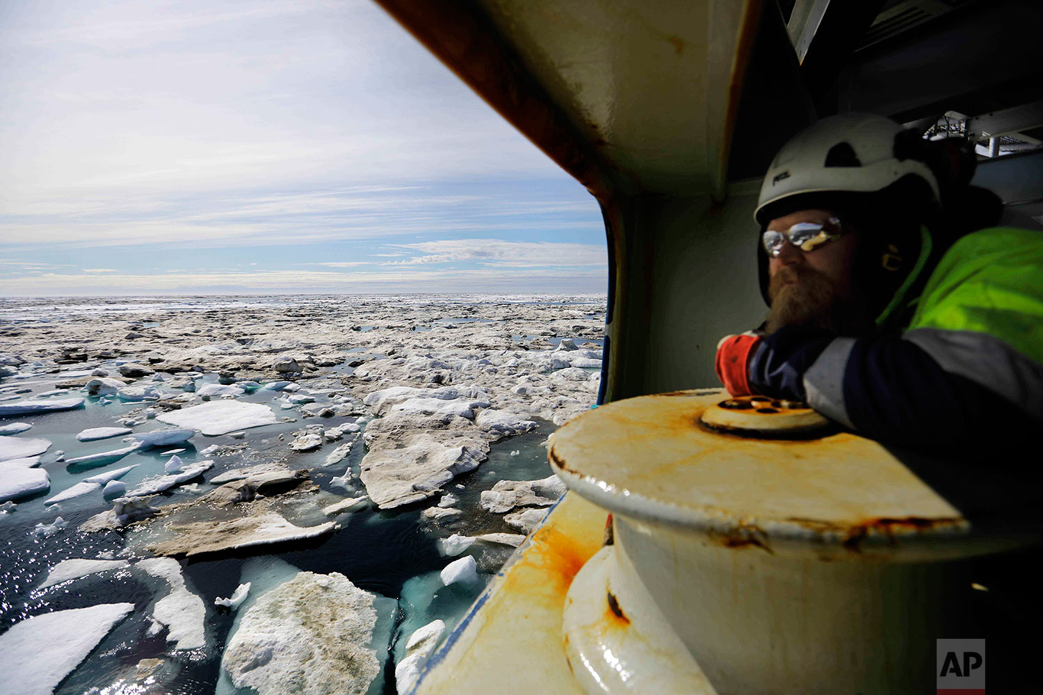  Trainee Jussi Mikkotervo looks out from the bow of the Finnish icebreaker MSV Nordica as it sails through ice floating on the Beaufort Sea off the coast of Alaska while traversing the Arctic's Northwest Passage, Sunday, July 16, 2017. Although the p
