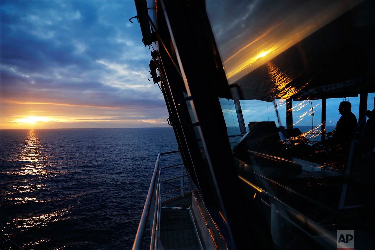 First officer Jukka Vuosalmi sits at the controls of the Finnish icebreaker MSV Nordica as it sets sail in the North Pacific Ocean toward the Bering Strait, Friday, July 7, 2017. A group of international researchers is sailing into the Arctic Sea aboard the Finnish icebreaker to traverse the Northwest Passage and record the environmental and social changes that are taking place in one of the most forbidding corners of the world. (AP Photo/David Goldman)