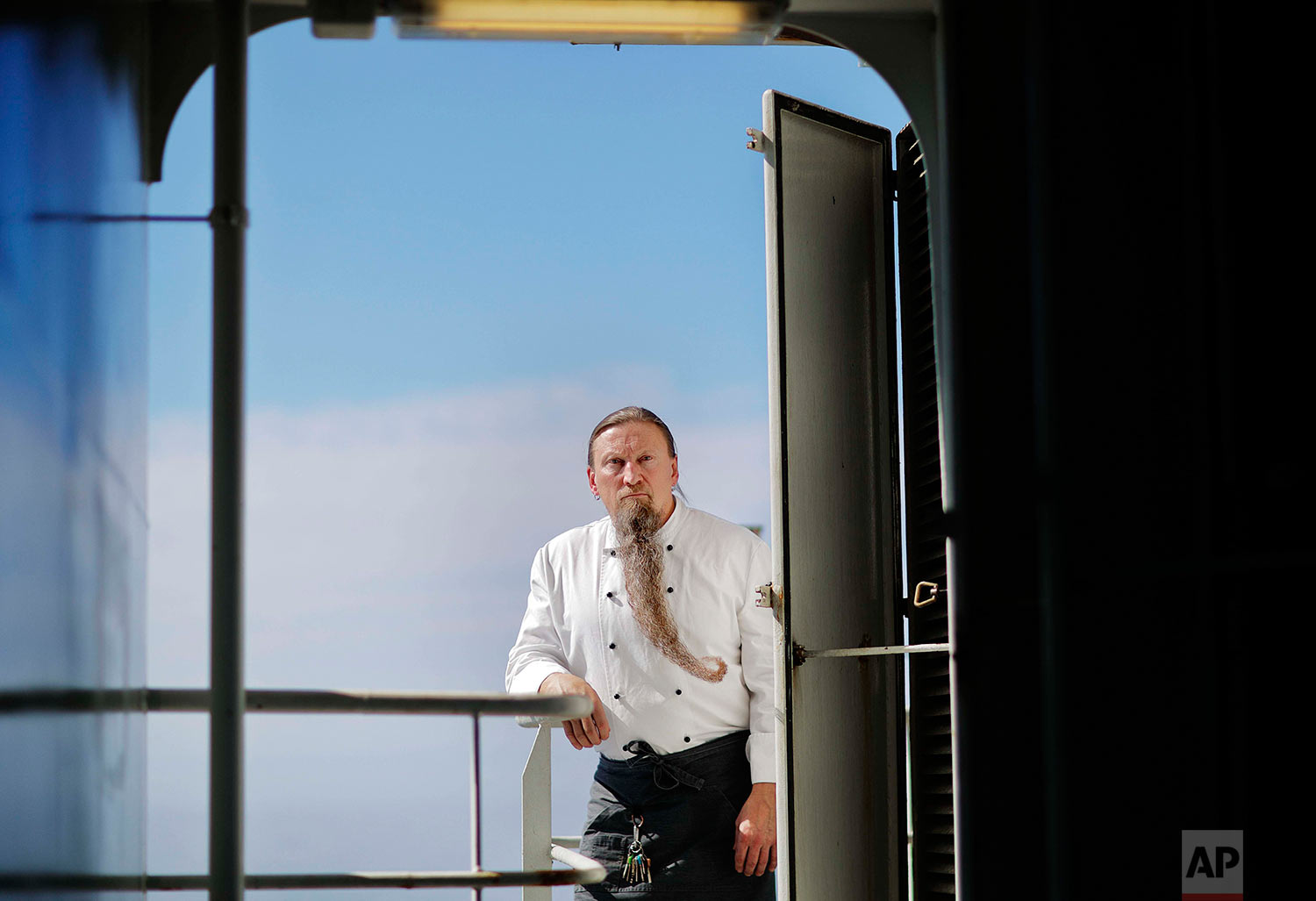  Chief steward Mika Tiilikka, 54, stands for a portrait aboard the Finnish icebreaker MSV Nordica as the ship sails north in the Chukchi Sea in the Arctic, Friday, July 14, 2017. Tiilikka, who has been growing his beard for 17 years, has worked aboar