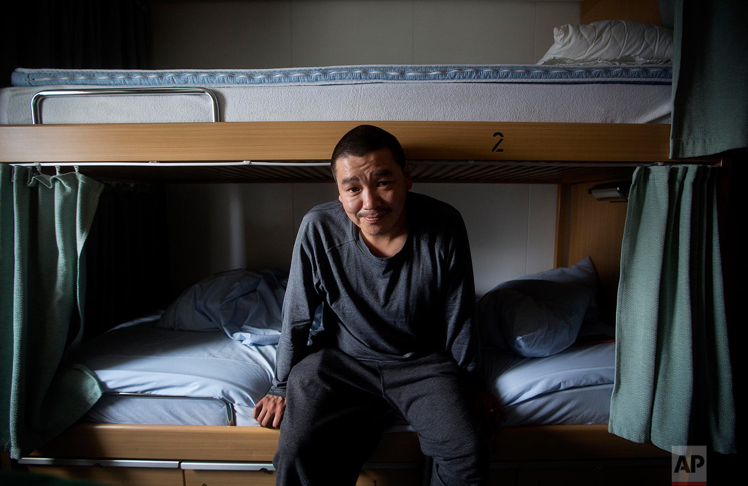  Trainee Maatiusi Manning, 33, of Cape Dorset, Nunavut, in Canada's northern territories, sits for a portrait on his bunk while resting from sea sickness aboard the Finnish icebreaker MSV Nordica as sails in the North Pacific Ocean toward the Bering 