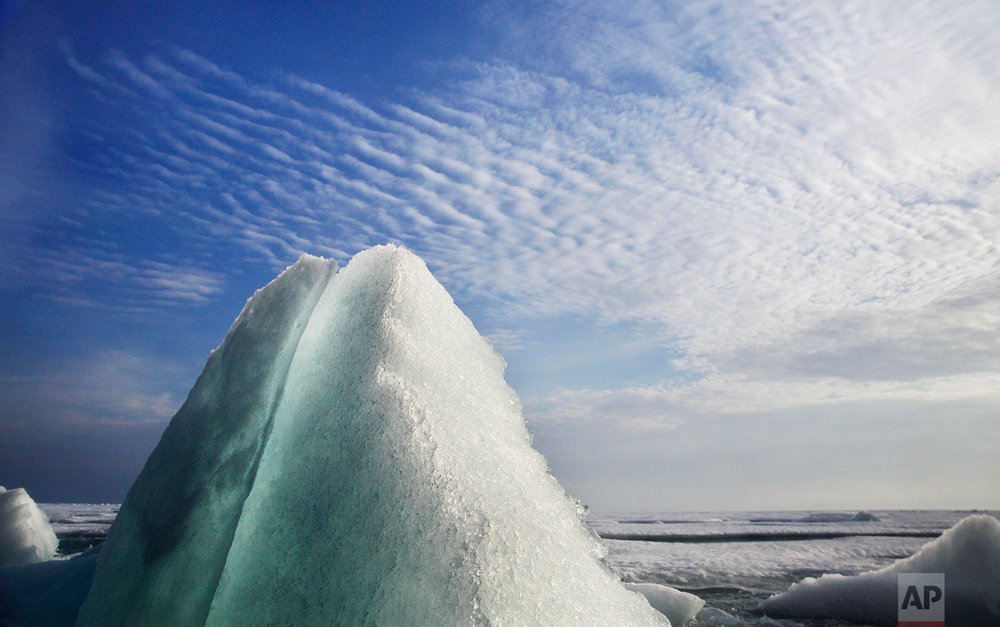  Broken sea ice emerges from under the hull of the Finnish icebreaker MSV Nordica as it sails through the Franklin Strait while traversing the Arctic's Northwest Passage, Saturday, July 22, 2017. Sea ice forms when the top layer of water reaches free