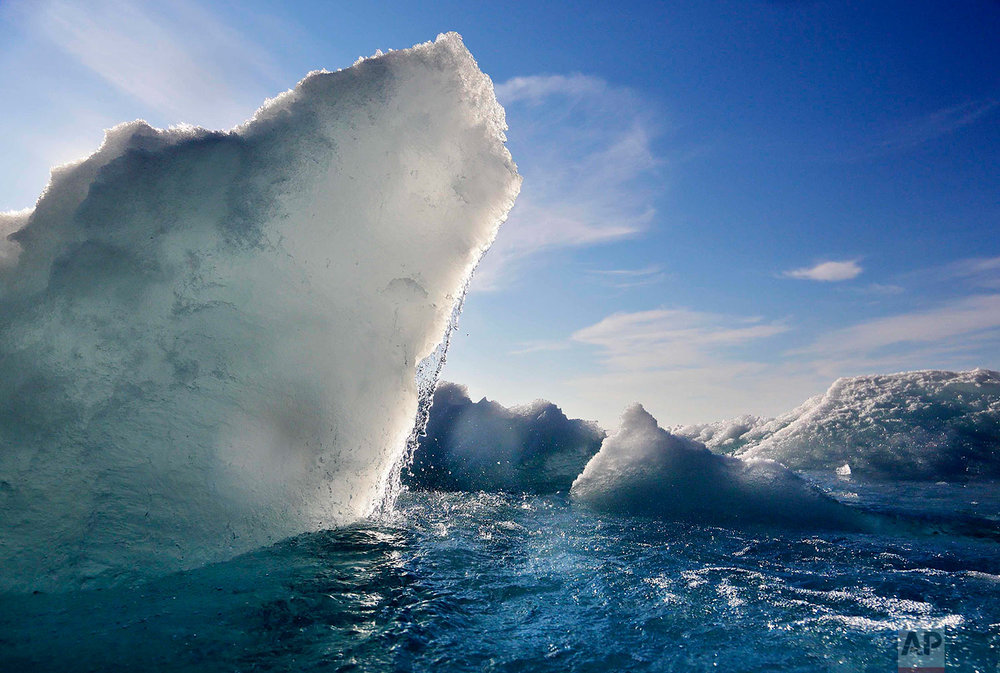  Broken sea ice emerges from under the hull of the Finnish icebreaker MSV Nordica as it sails through the Victoria Strait while traversing the Arctic's Northwest Passage, Friday, July 21, 2017. (AP Photo/David Goldman) 