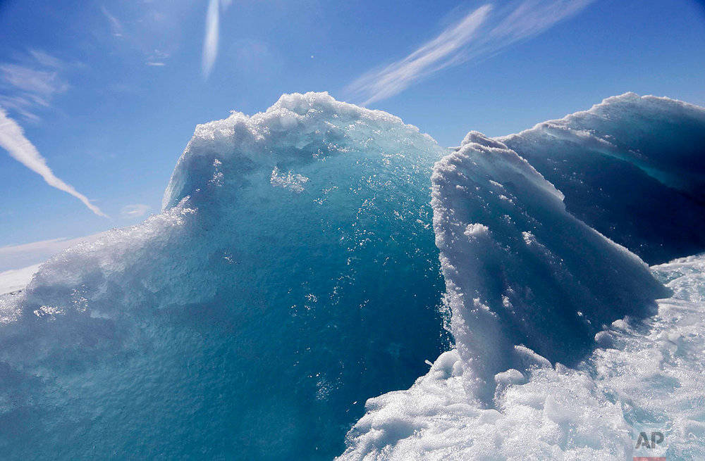  Broken sea ice emerges from under the hull of the Finnish icebreaker MSV Nordica as it sails through the Victoria Strait while traversing the Arctic's Northwest Passage, Friday, July 21, 2017. As a general rule, the older ice gets the more it turns 