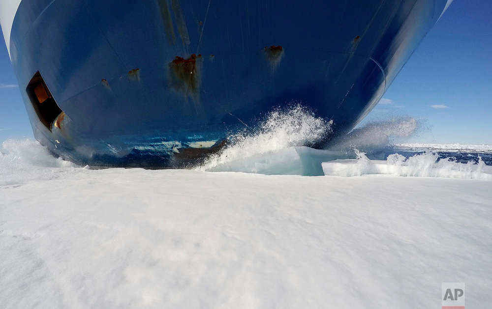  The bow of the Finnish icebreaker MSV Nordica drives through sea ice as it sails the Victoria Strait while traversing the Arctic's Northwest Passage, Friday, July 21, 2017. The MSV Nordica is equipped with several heavy-duty engines and a hardened b