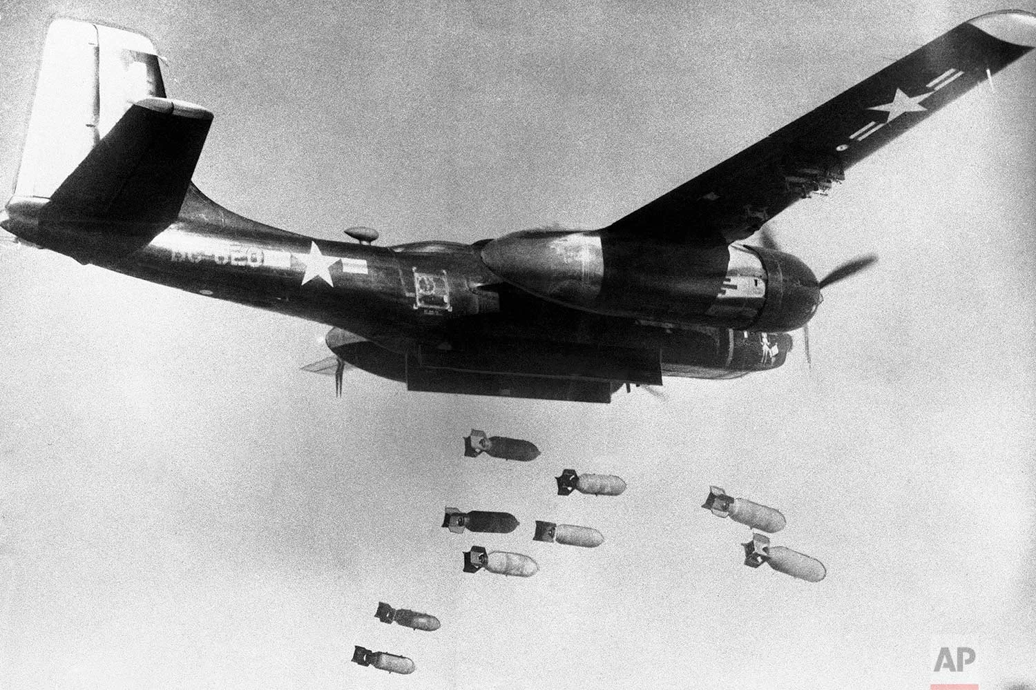 In this March 18, 1953, photo, bombs drop from a U.S. Air Force 3rd bomber wing B26 light bomber somewhere in North Korea. (U.S. Air Force via AP)