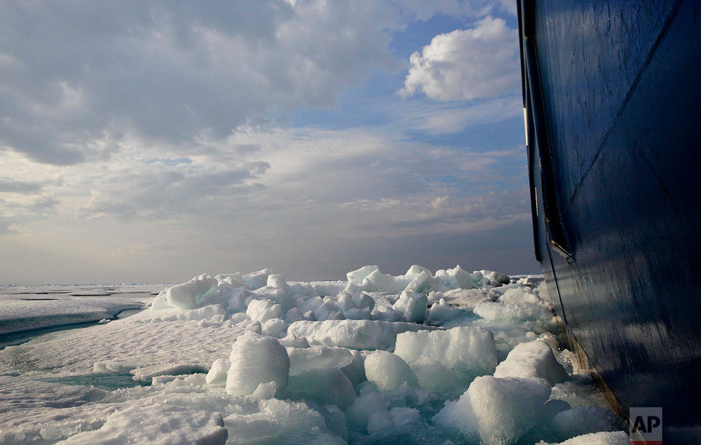  Broken sea ice is pushed aside as the Finnish icebreaker MSV Nordica sails through the Franklin Strait while traversing the Arctic's Northwest Passage, Saturday, July 22, 2017. Sea ice forms when the top layer of water reaches freezing point, usuall