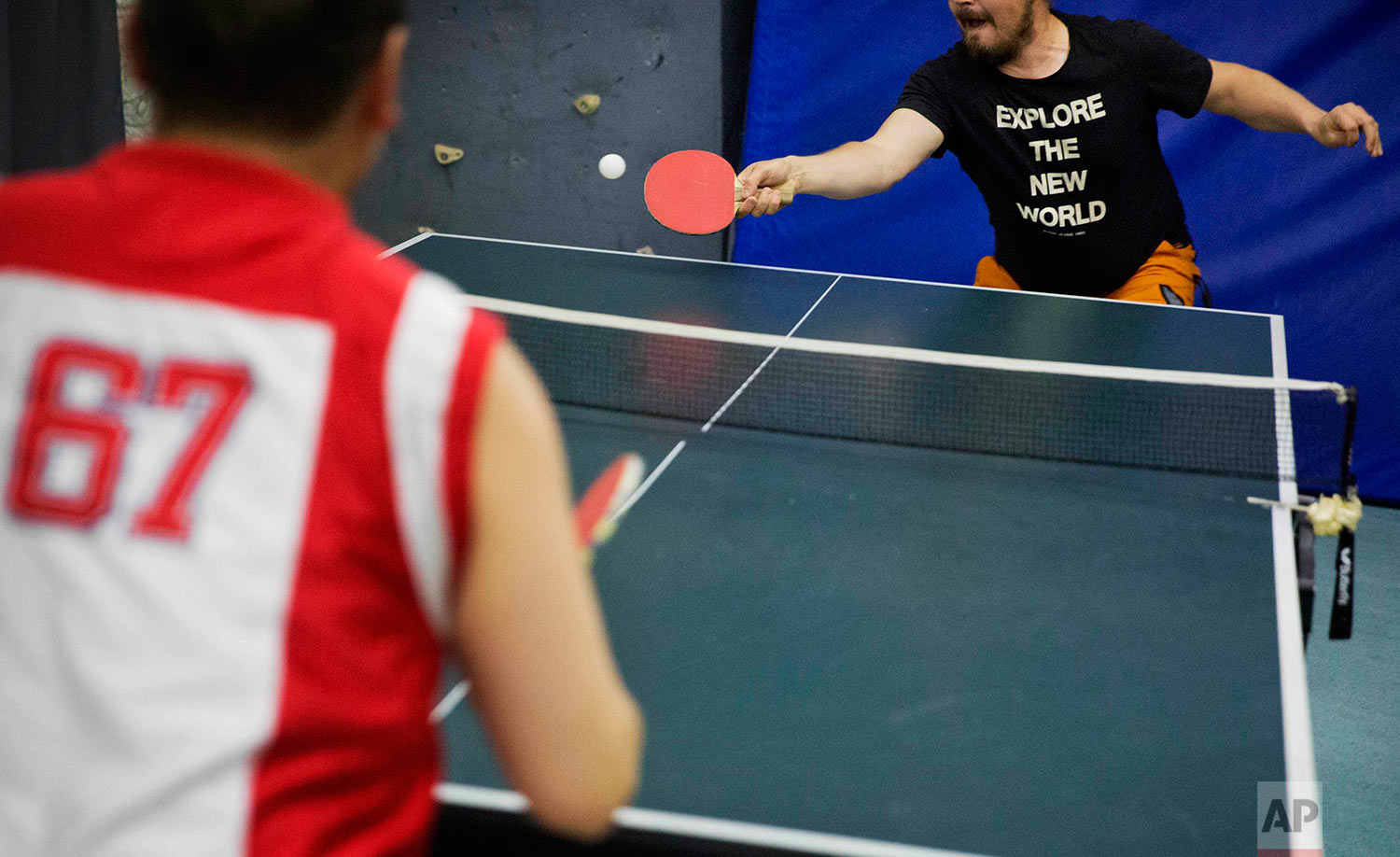  In this Saturday, July 8, 2017 photo, researcher Ari Laakso, right, plays ping pong with trainee Maatiusi Manning aboard the Finnish icebreaker MSV Nordica as it sails the North Pacific Ocean to traverse the Northwest Passage through the Canadian Ar