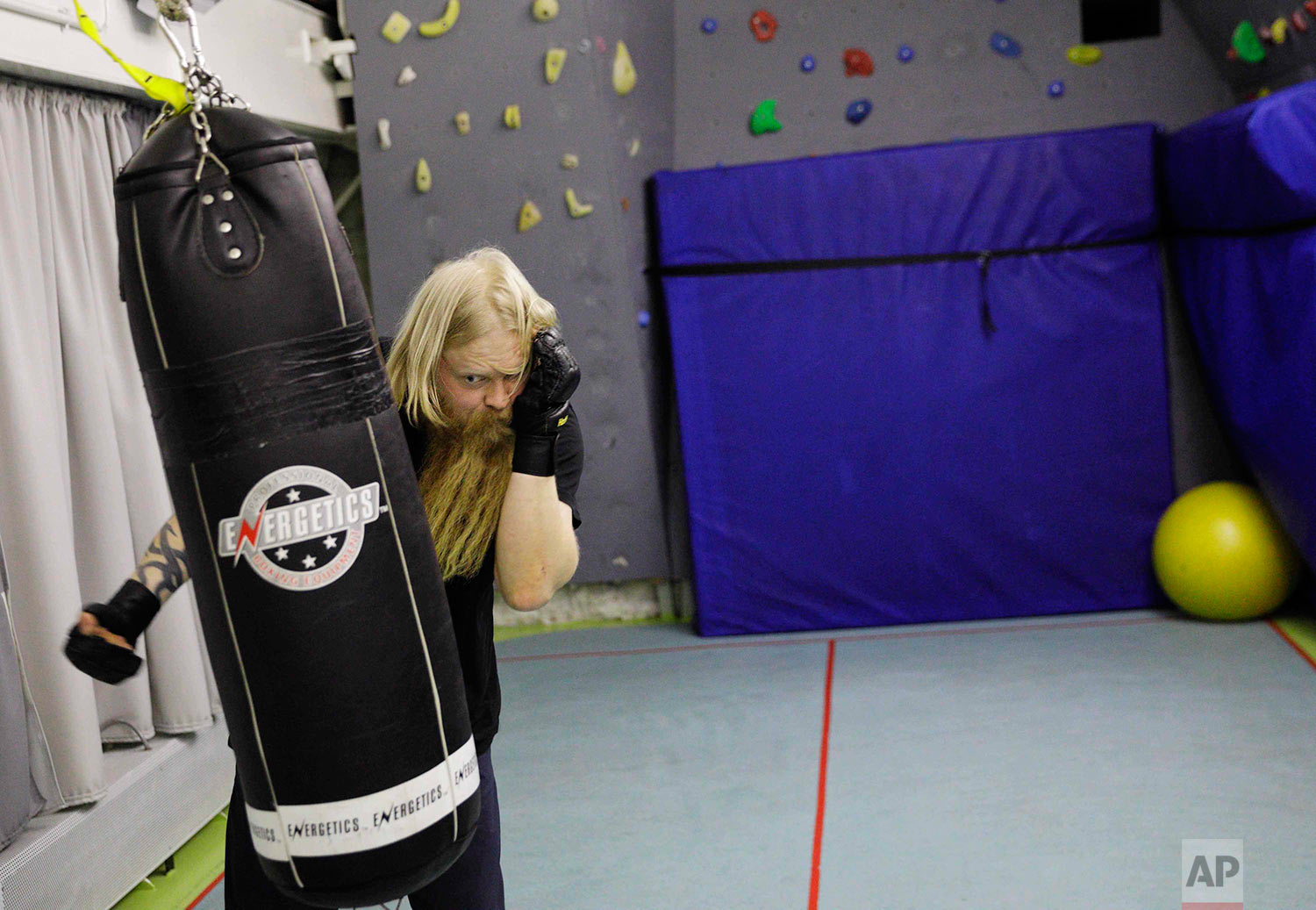  In this Tuesday, July 18, 2017 photo, trainee Jussi Mikkotervo works out on a punching bag aboard the Finnish icebreaker MSV Nordica as it sails the Beaufort Sea to traverse the Northwest Passage through the Canadian Arctic Archipelago. (AP Photo/Da