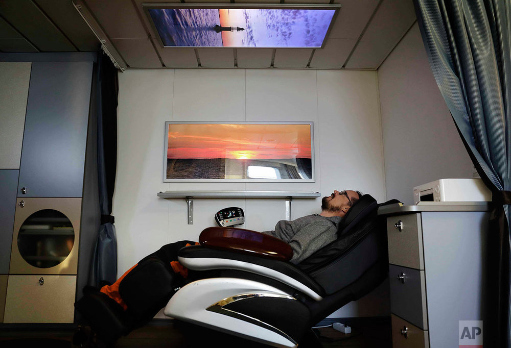  In this Thursday, July 6, 2017 photo, researcher Ari Laakso reclines in a massage chair aboard the Finnish icebreaker MSV Nordica as it sails the North Pacific Ocean to traverse the Northwest Passage through the Canadian Arctic Archipelago. (AP Phot