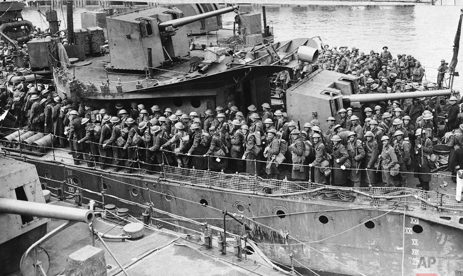  Troops of the British expeditionary force landing from a destroyer at a British port on June 1, 1940 after being evacuated, following heroic fighting, from Flanders. (AP Photo) 
