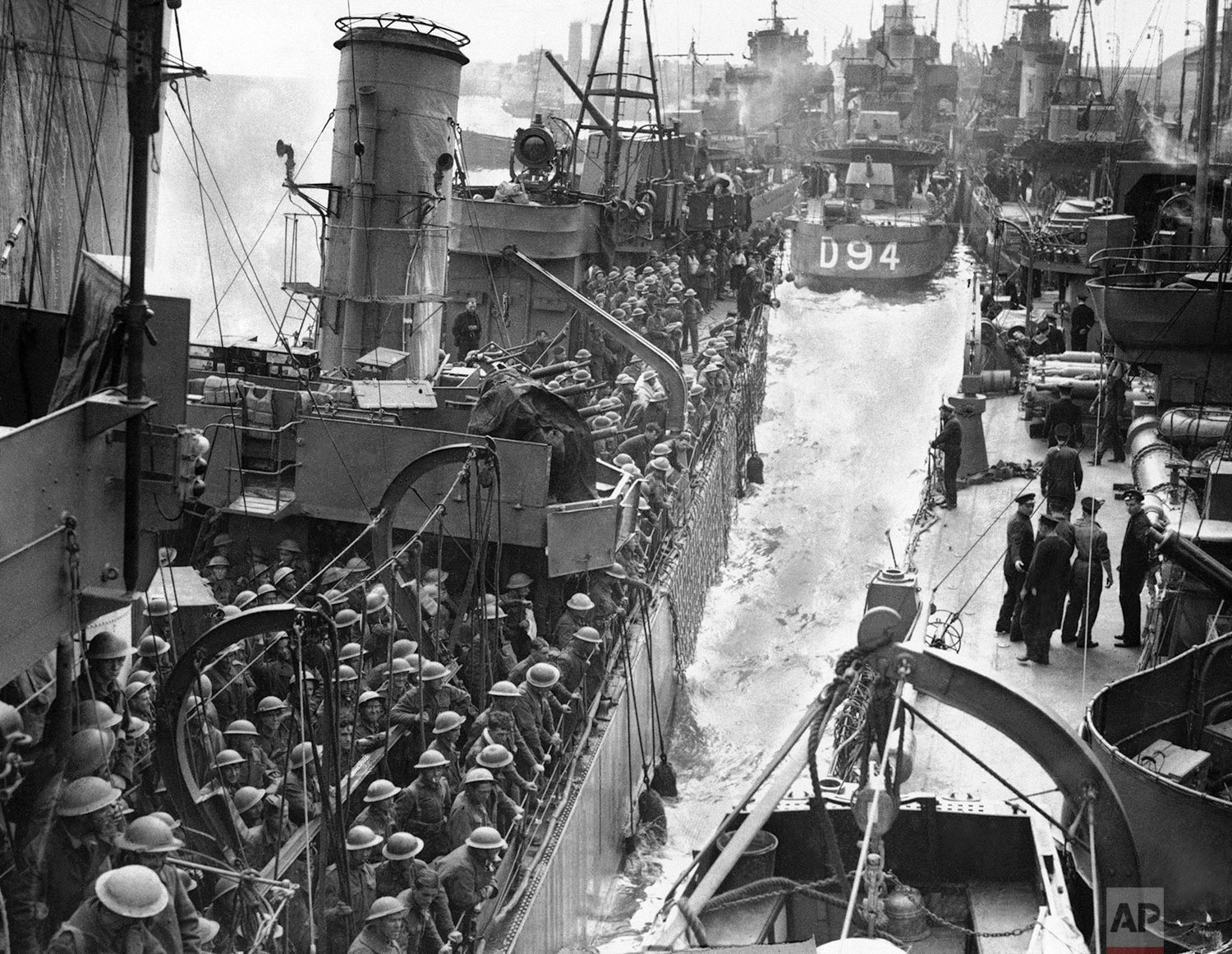  Men of the B.E.F. safely home after their gallant fight in Flanders seen on transport ships at the Quayside on June 6, 1940. Many sorts and sizes of vessels taking part in the grand evacuation from Dunkirk. (AP Photo) 