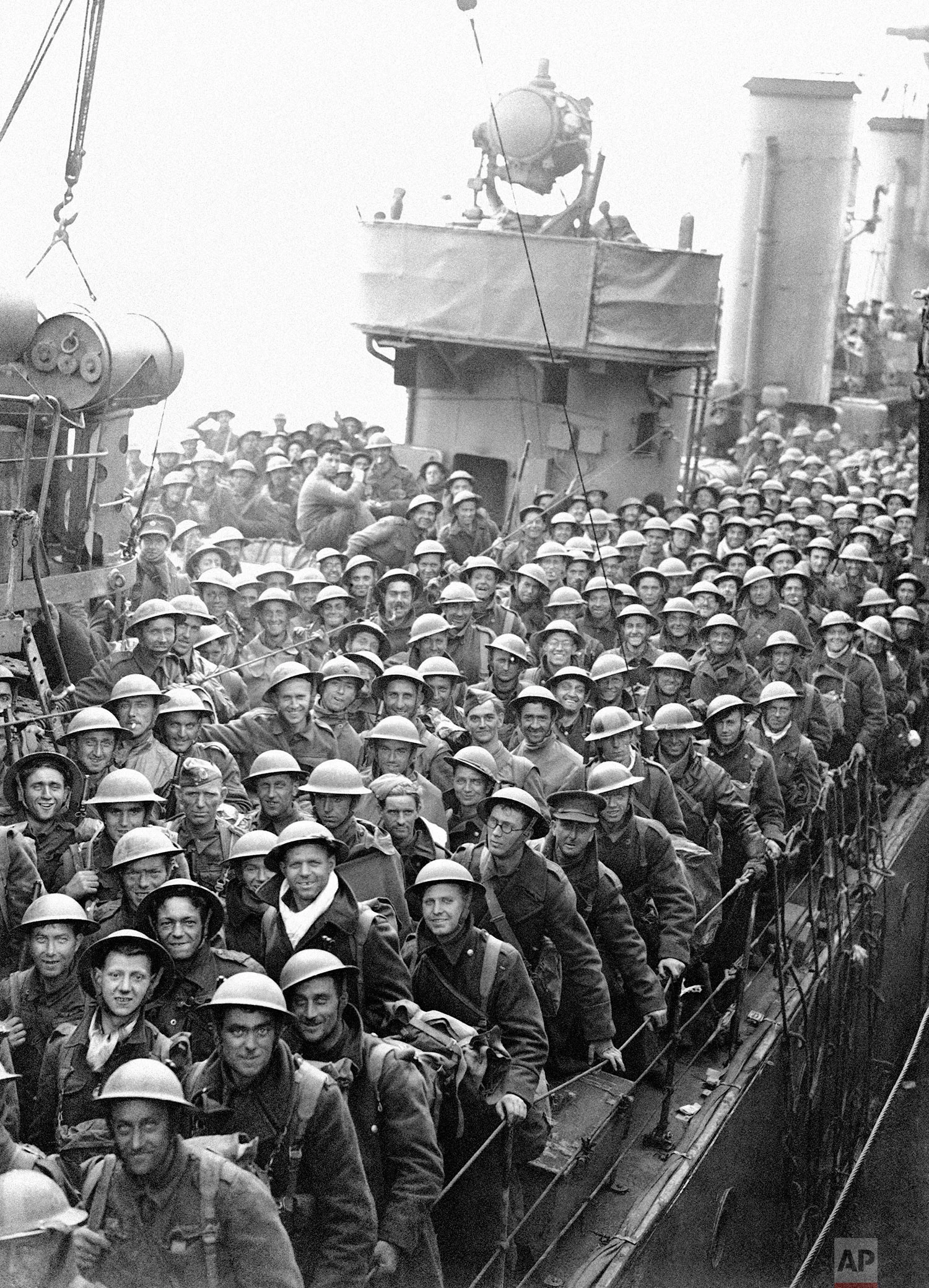 Hundreds of men of the British Expeditionary Force withdrawn from Dunkirk and Northern France are arriving back in England in a continuous stream. A destroyer’s deck loaded with men of the B.E.F., May 31, 1940, somewhere in England. (AP Photo)
