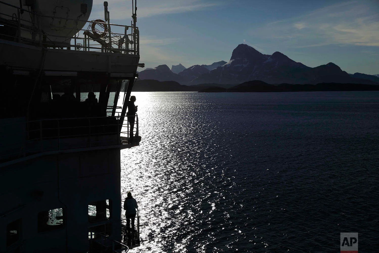 Personnel stand aboard the Finnish icebreaker MSV Nordica as it arrives into Nuuk, Greenland, after traversing the Northwest Passage through the Canadian Arctic Archipelago, Saturday, July 29, 2017. After 24 days at sea and a journey spanning more than 10,000 kilometers (6,214 miles), the MSV Nordica has set a new record for the earliest transit of the fabled Northwest Passage. The once-forbidding route through the Arctic, linking the Pacific and the Atlantic oceans, has been opening up sooner and for a longer period each summer due to climate change. (AP Photo/David Goldman)