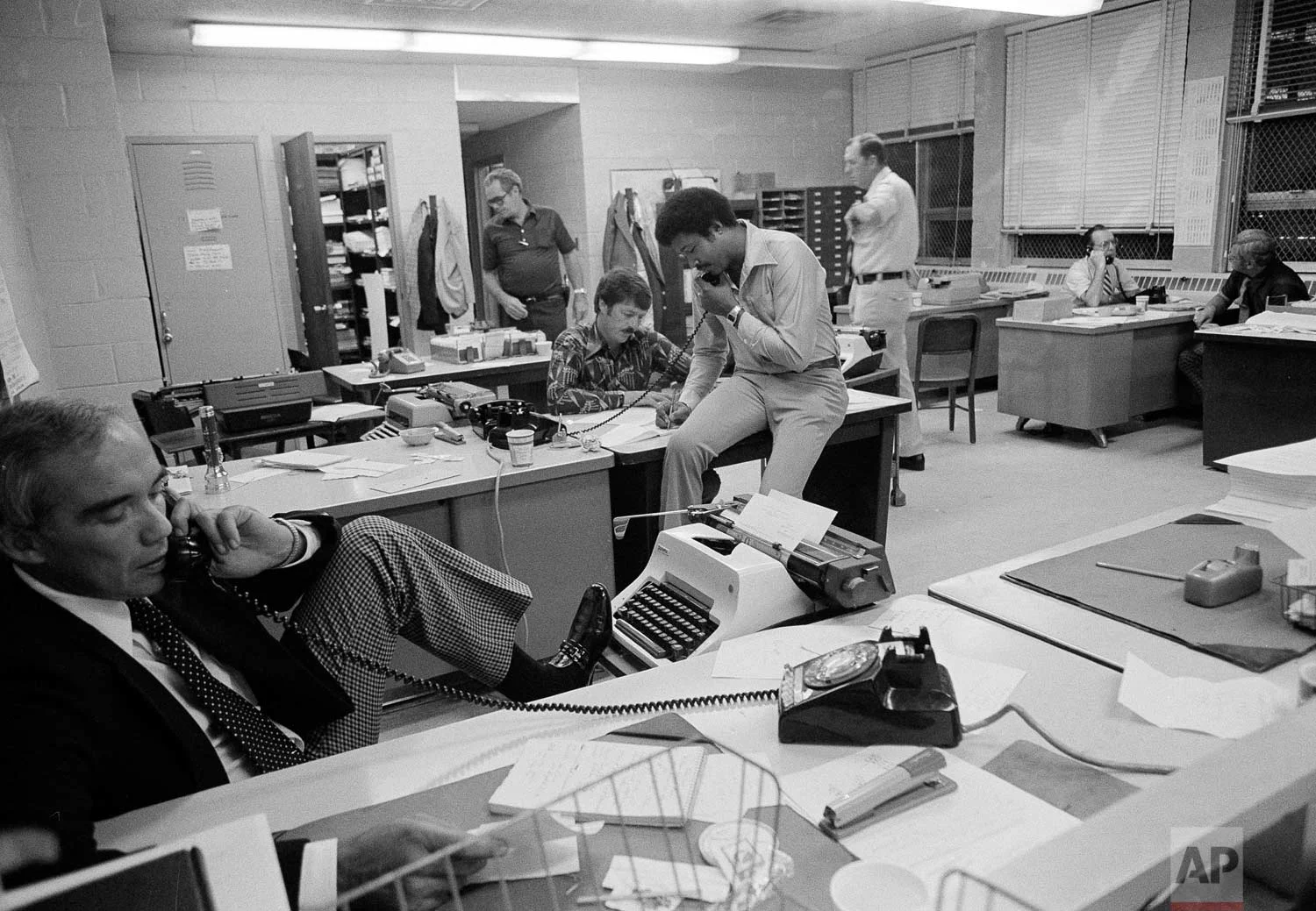 New York City police are seen at work on the "Son of Sam" serial killer case at Police Headquarters in New York, July 19, 1977. (AP Photo/Richard Drew)