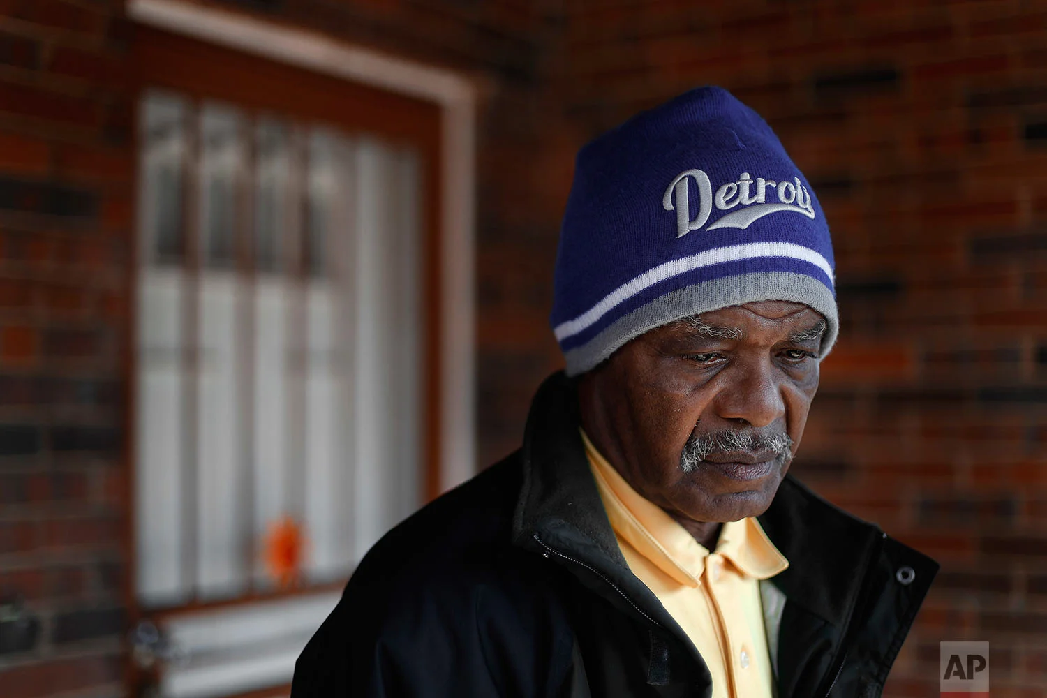 John Hall stands outside his transitional home in Detroit on Friday, March 24, 2017. A half-century after he was convicted of murder at the age of 17, he still cringes when he remembers the judge's words at sentencing: "You're unfit, you're a throwaway, you're a predator and you should be put away for the rest of your life." "Everything was a blur and everything was moving so fast," Hall says. "But when I looked at my mother's face ... it was a look that I'd never seen before. It was a hurt look ... a helplessness." (AP Photo/Paul Sancya)