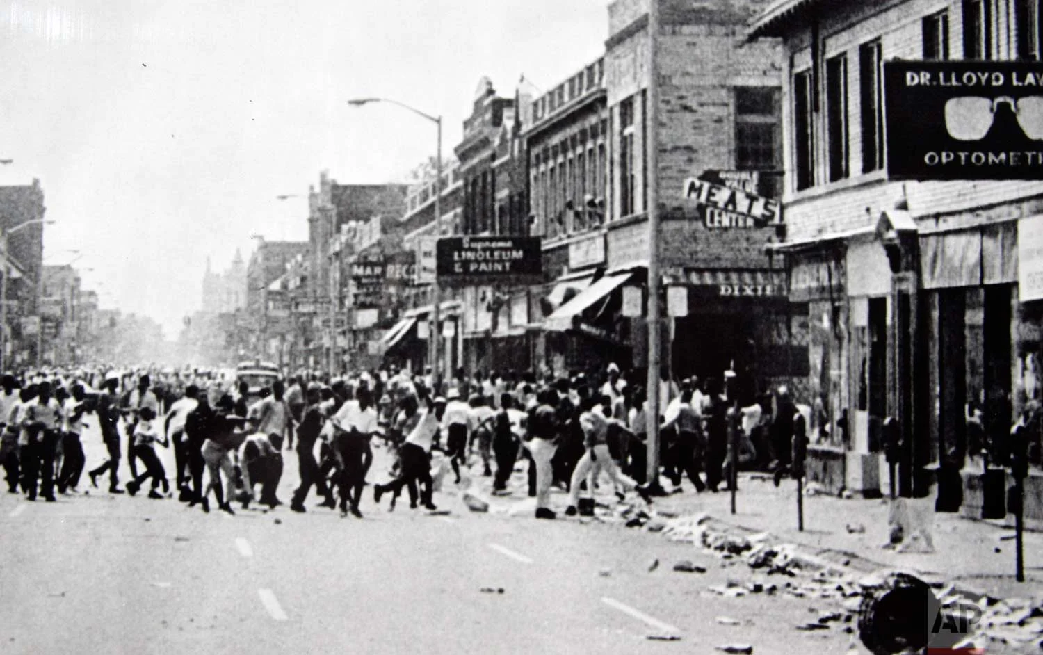 In this July 23, 1967 photo, hundreds of people run down 12th Street on Detroit's westside throwing stones and bottles at storefronts. The riot started after police raided an after-hours club in a predominantly African-American neighborhood. The raid, though, was just the spark. Many in the community blamed frustrations blacks felt toward the mostly white police, and city policies that pushed families into aging and over-crowded neighborhoods. (AP Photo)