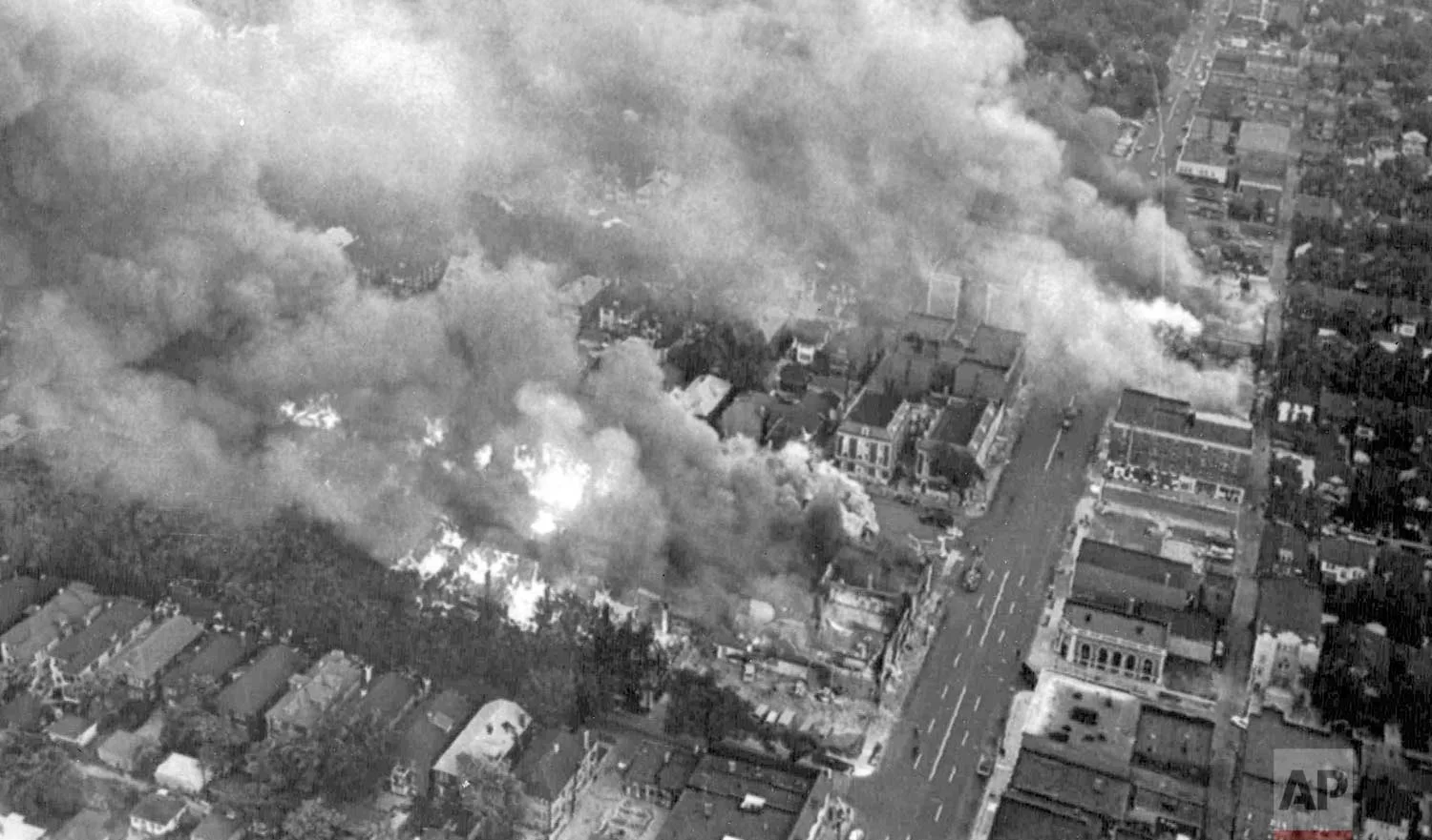 In this July 24, 1967 photo, multiple fires burn in a section of riot-torn Detroit, about three miles west of the downtown area. Five days of violence would leave 33 blacks and 10 whites dead, and more than 1,400 buildings burned. More than 7,000 people were arrested. (AP Photo)